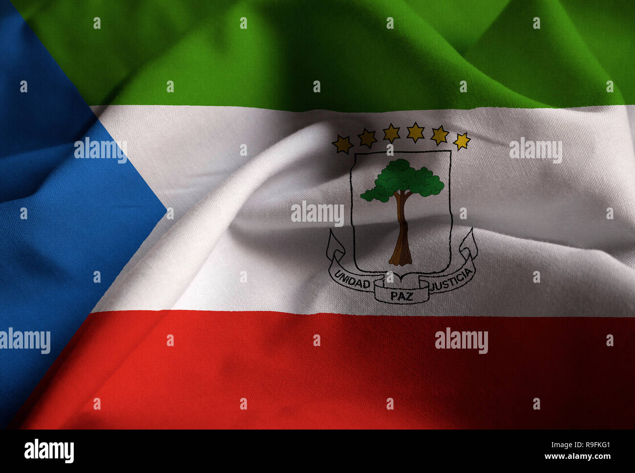 Closeup of Ruffled Equatorial Guinea Flag, Equatorial Guinea Flag Blowing in Wind Stock Photo