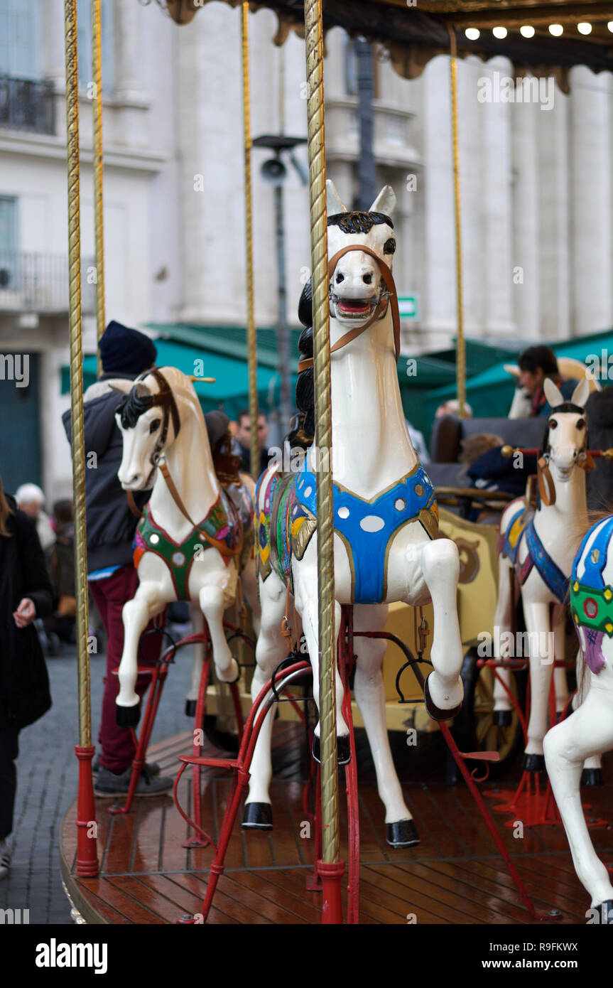 Rome, antique merry go round in piazza Navona Christmas market. Stock Photo