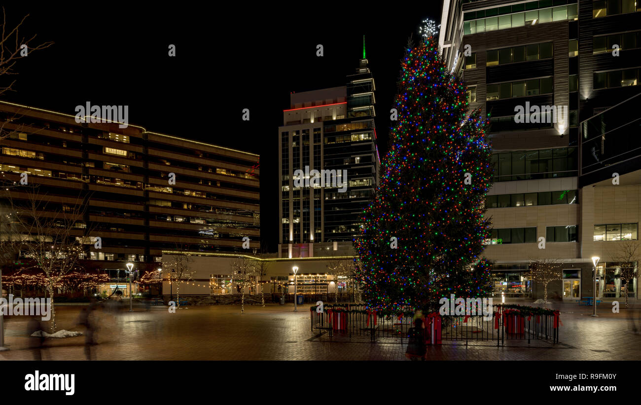 Downtown Boise Idaho Christmas tree on the Grove with tall building surrounding Stock Photo