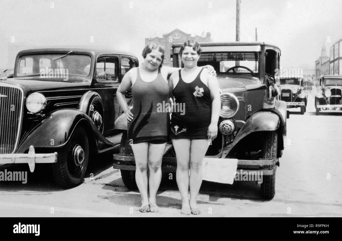 Two plump sisters pose in front of their car in the parking lot of Coney  Island,ca. 1932 Stock Photo - Alamy