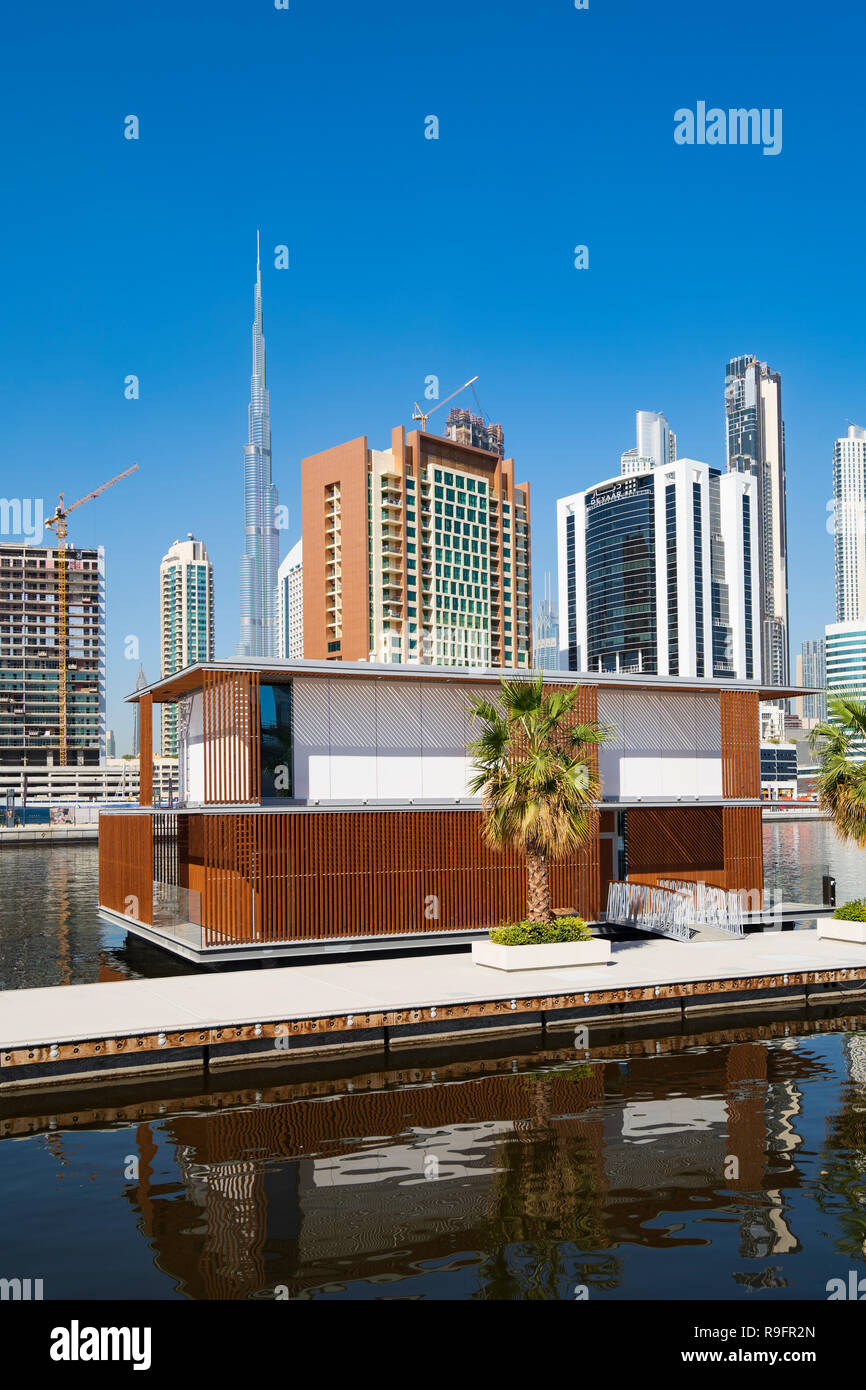 Modern skyline and new floating villas on The Creek in Business Bay in Dubai, United Arab Emirates Stock Photo