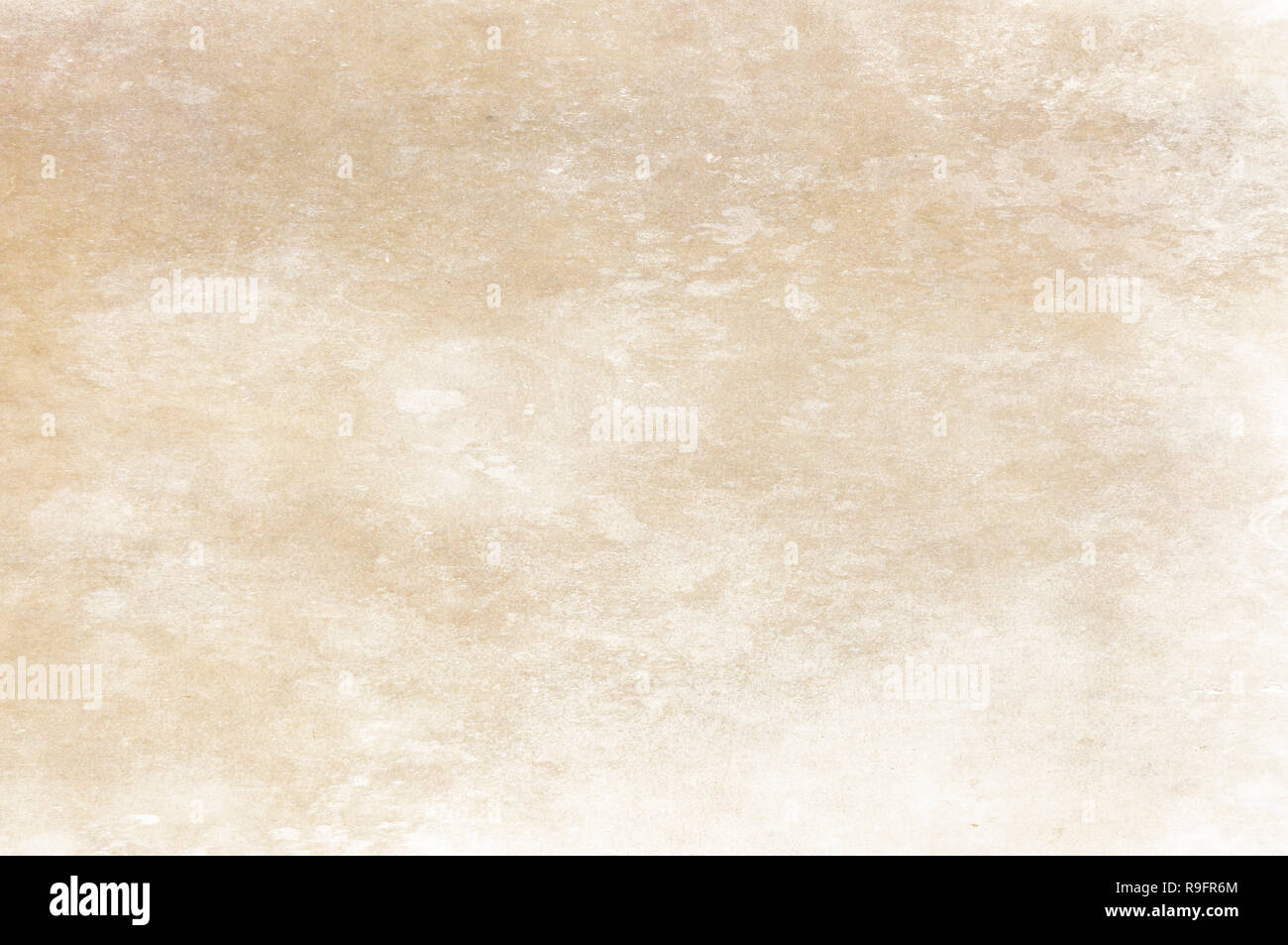 Old dirty and yellowed paper texture. Natural paper background for design. Stock Photo