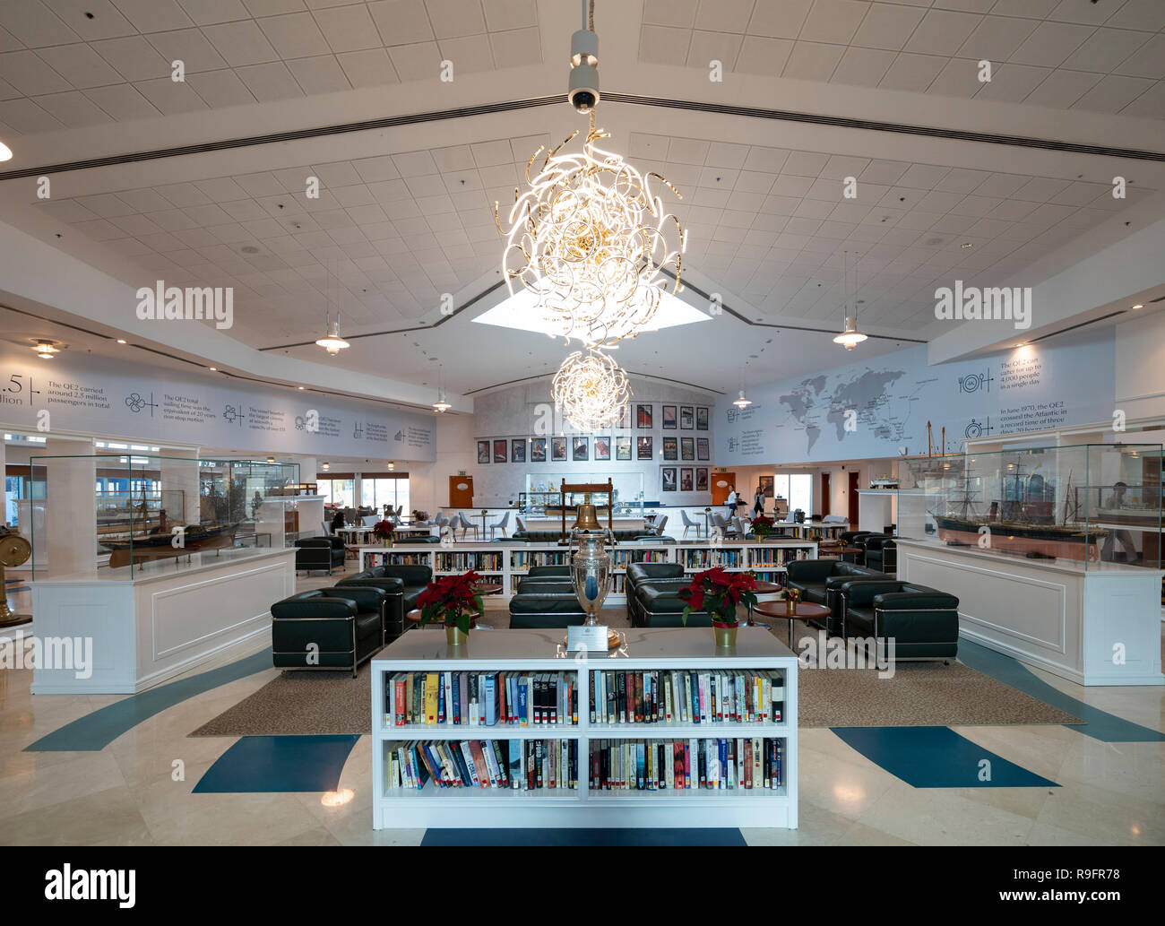 Interior of Queen Elizabeth 2 hotel reception area with library stocked with books from the original cruise liner in Dubai, United Arab Emirates. Stock Photo