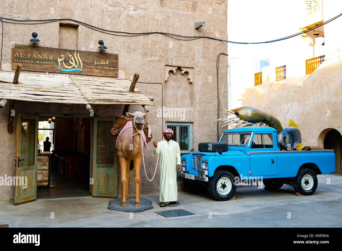 entrance to cafe at Al Seef cultural district, built with traditional architecture and design, by The Creek waterside in Dubai, United Arab Emirates Stock Photo