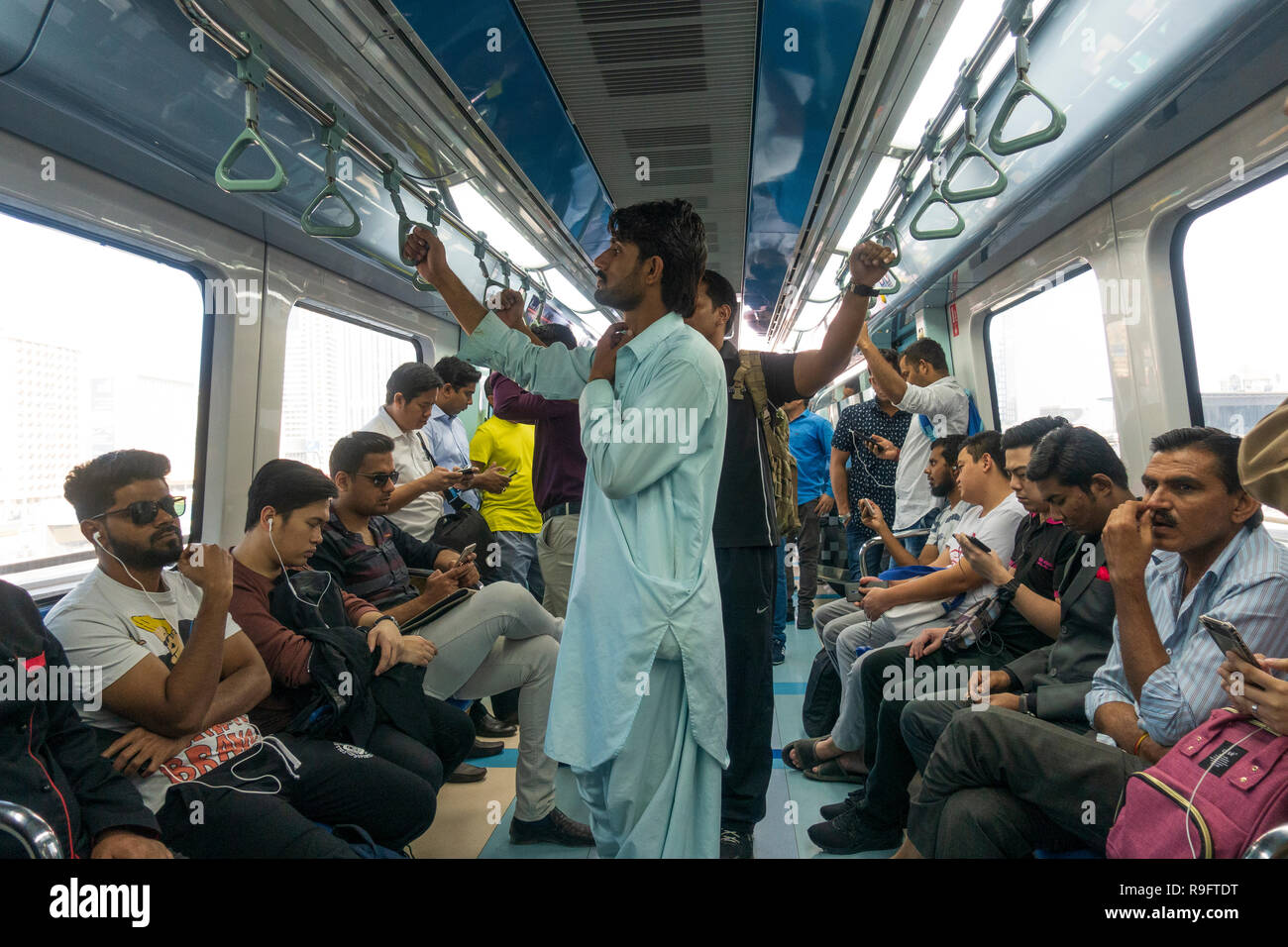 Passengers inside carriage on the Dubai metro, United Arab Emirates Stock Photo