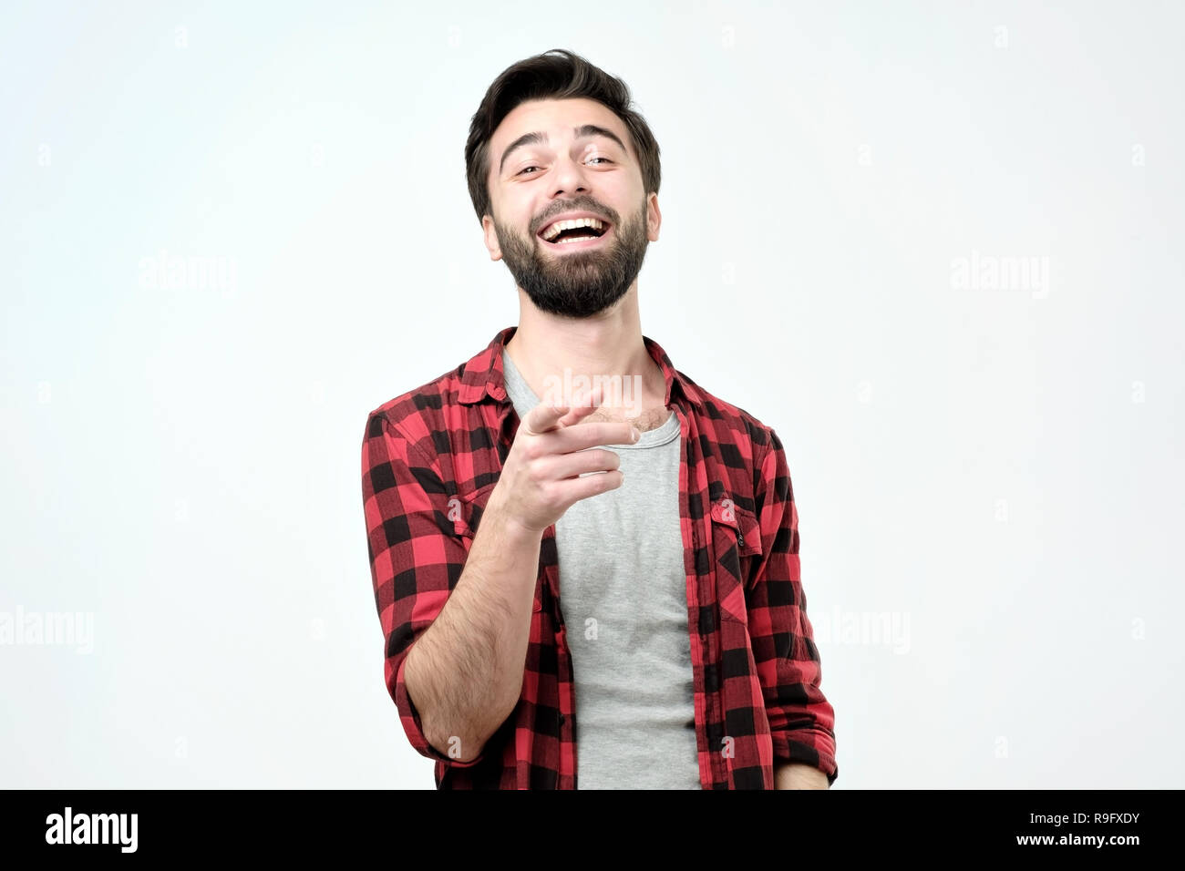 Spanish man mocking you or laughing on his friend joke Stock Photo