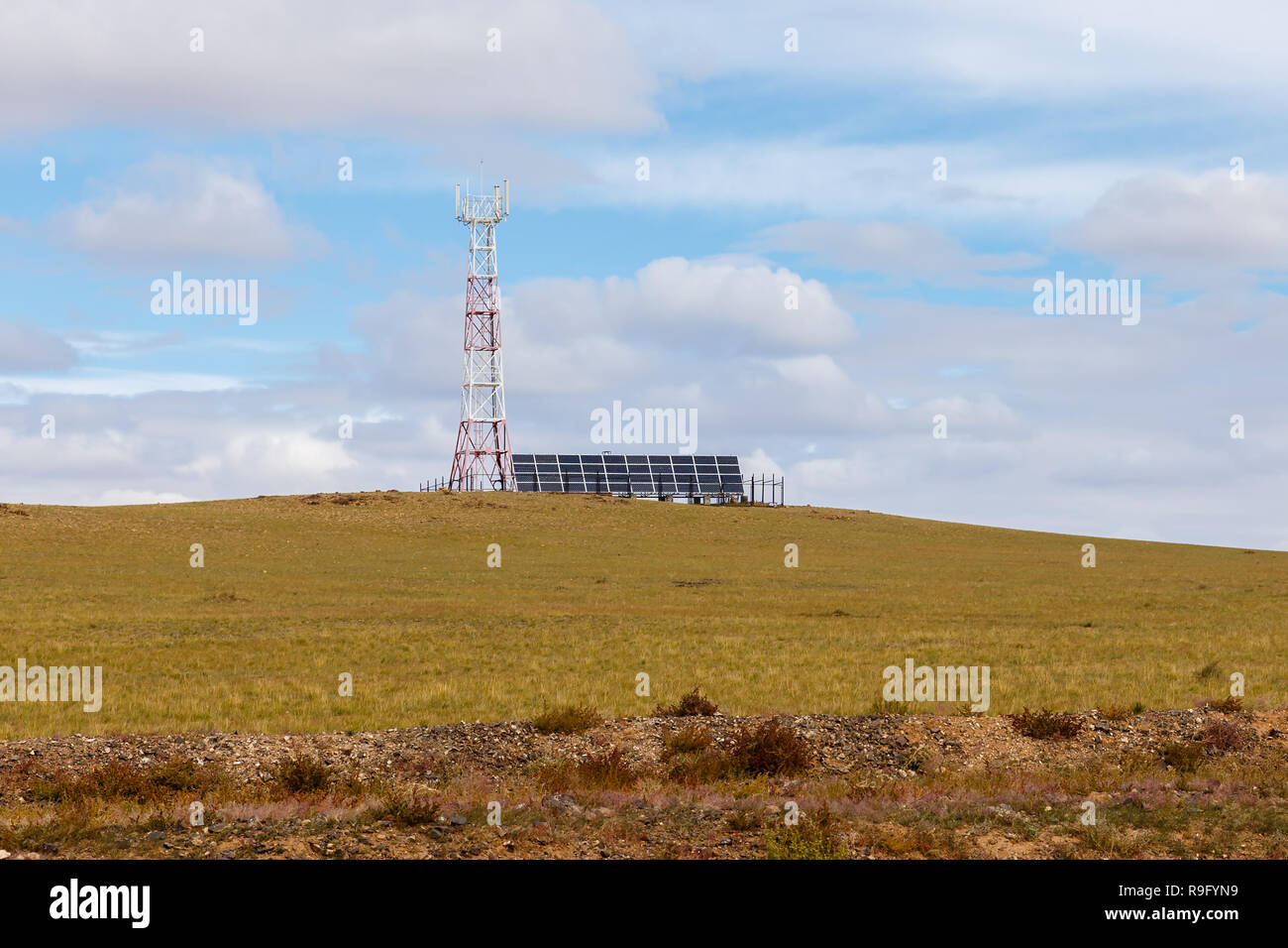 tower of cellular communication with solar panels Stock Photo - Alamy
