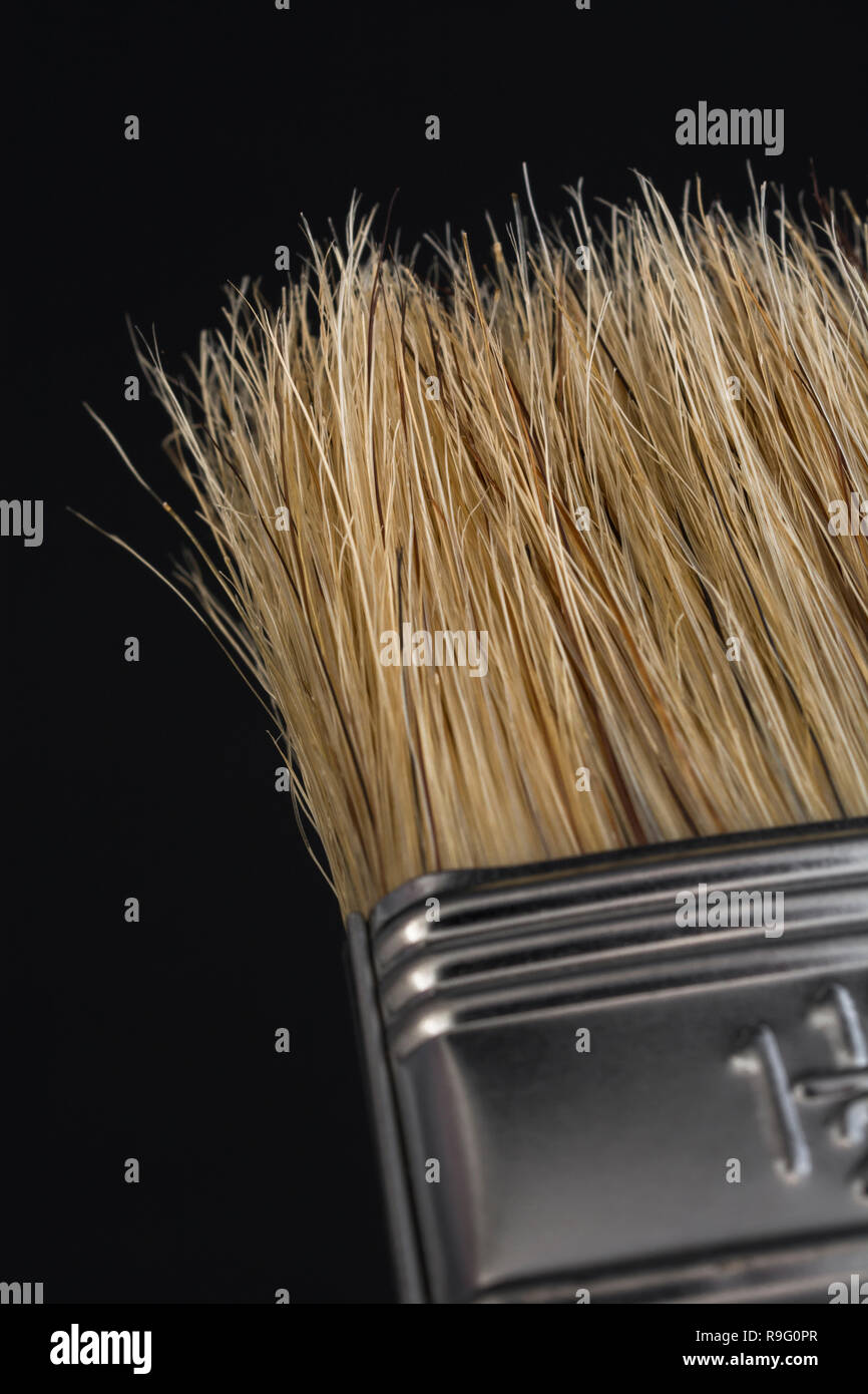 Close-up macro-photo of Natural bristle wooden paint brush - metaphor for home decoration / decorating, painted in broad strokes, painting. Stock Photo