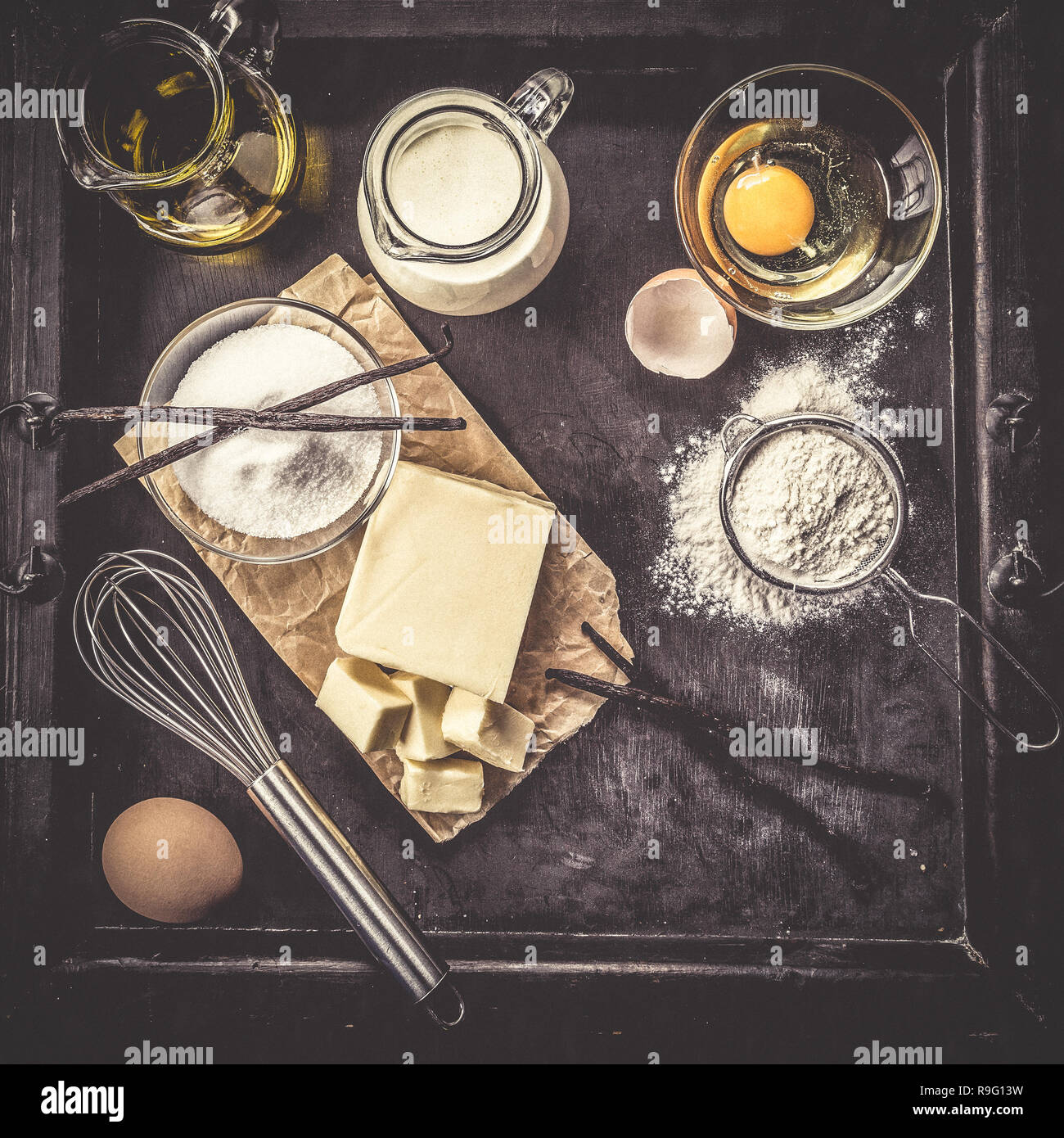 Baking ingredients butter cream eggs flour sugar vanilla hires stock