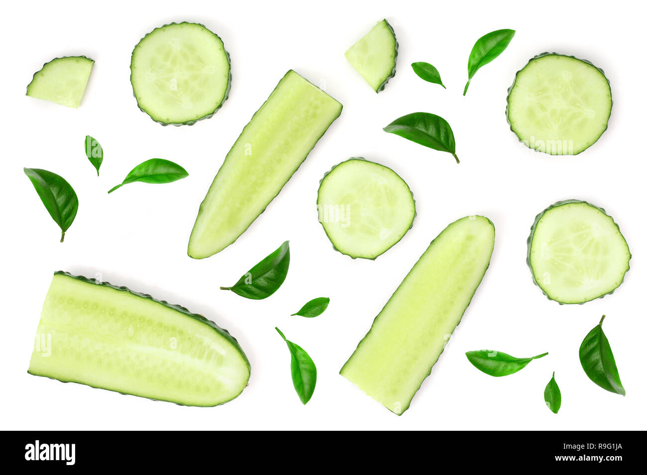 Cucumber slices isolated on white background. Top view. Flat lay pattern. Stock Photo