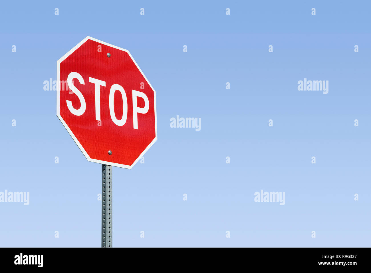 Stop Sign And Blue Sky Stock Photo