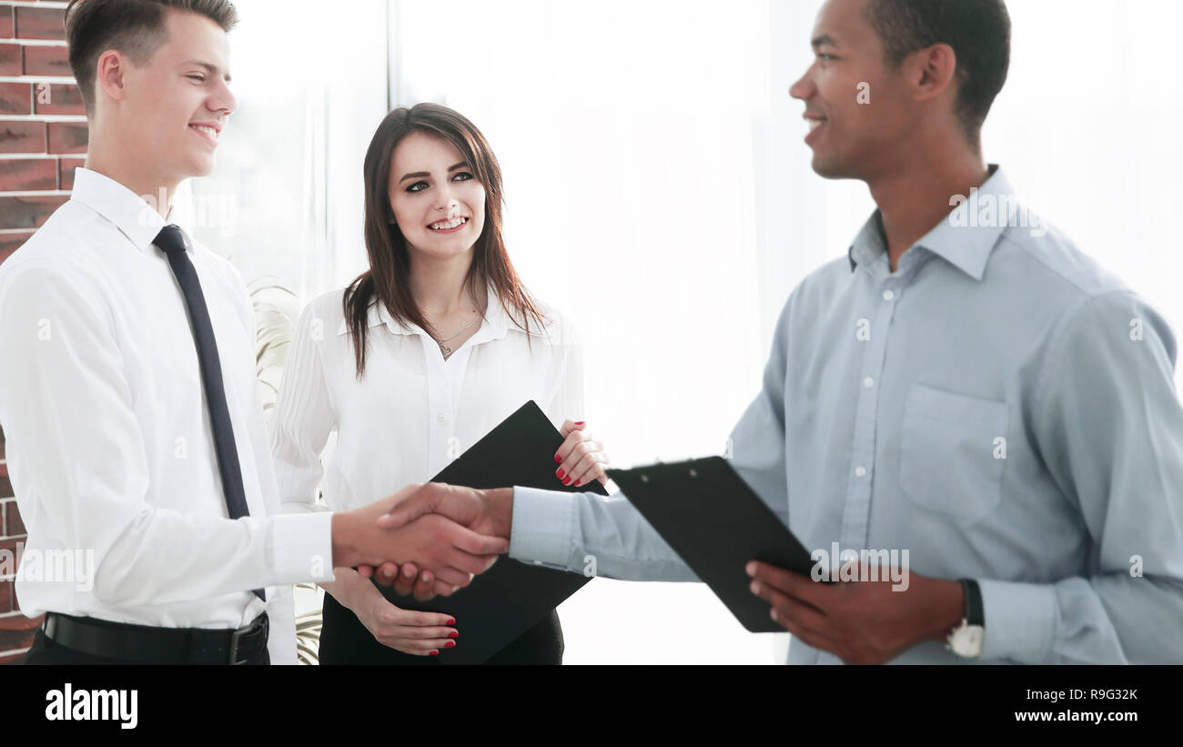 handshake of young business partners in the office Stock Photo