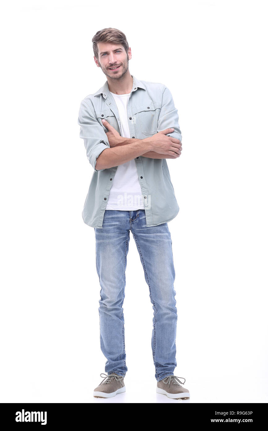 in full growth. smiling young man in jeans Stock Photo - Alamy