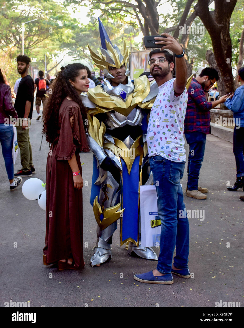 Mumbai, India. 23rd Dec, 2018. Visitor seen taking a selfie with a cosplayer during the second day of the 8th 'Mumbai Comic Con 2018' at Bombay Exhibition Center in Mumbai. Credit: Azhar Khan/SOPA Images/ZUMA Wire/Alamy Live News Stock Photo