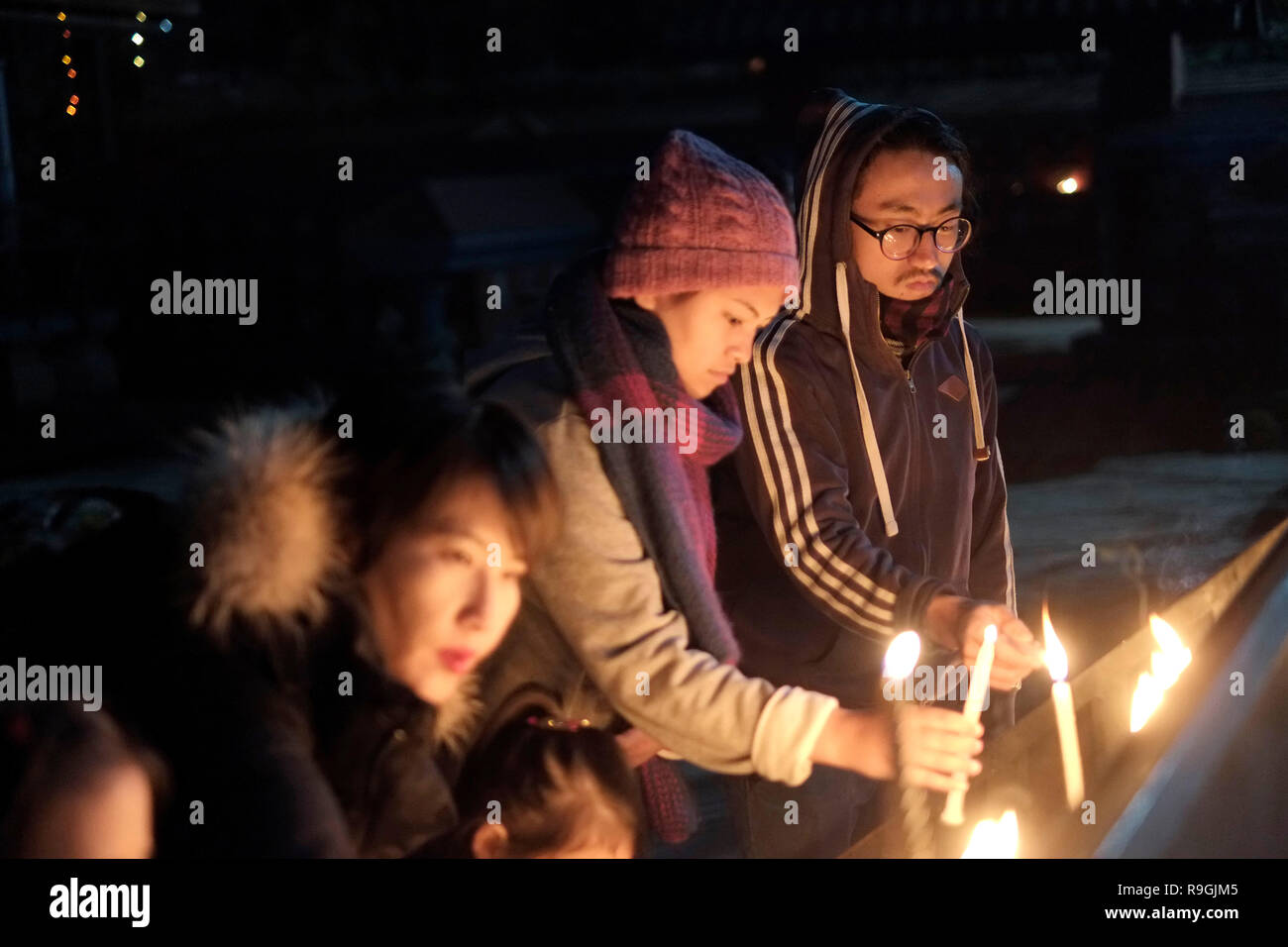 People seen lighting candles during the mass. Nepalese Christians