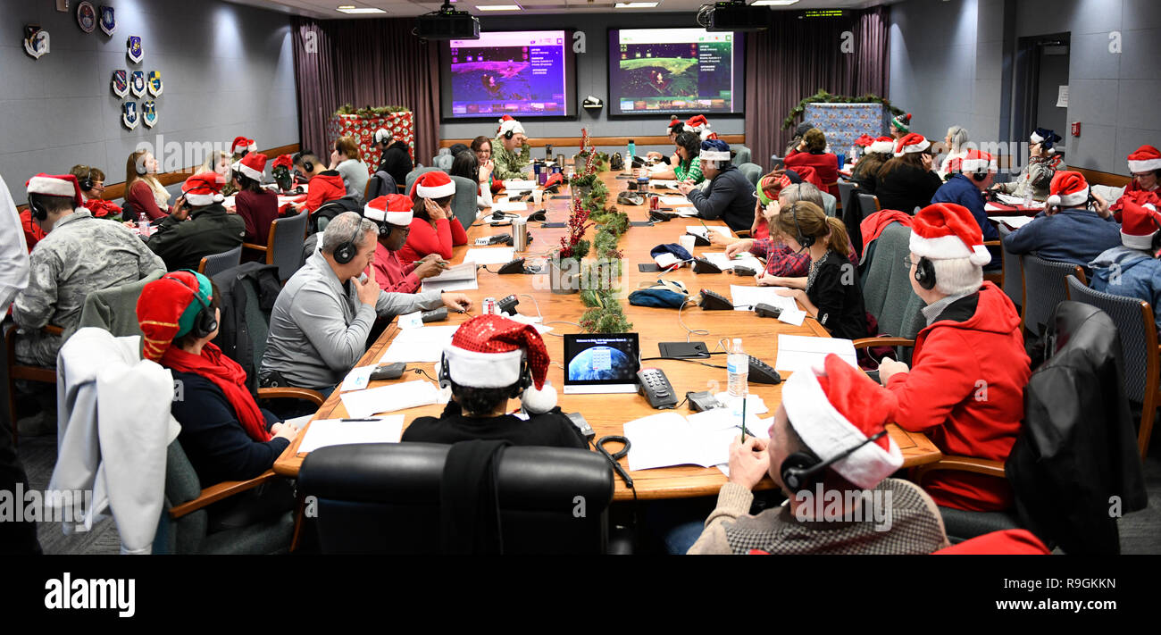 Colorado Springs, Colorado, USA. 24th Dec 2018. Volunteers answer phones and emails from children around the world during the annual NORAD Tracks Santa event at Peterson Air Force Base December 24, 2018 in Colorado Springs, Colorado. Last year NTS had more than 1,600 volunteers answering 125,000 phone calls, 2,000 emails and 7,450 on-star requests from children around the world asking where Santa is at and when will he arrive at their house. Credit: Planetpix/Alamy Live News Stock Photo