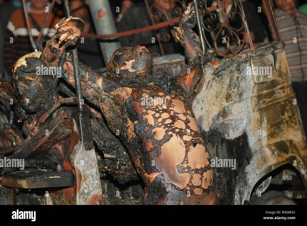 (EDITOR'S NOTE: IMAGE DEPICTS DEATH) After math of the crash seen with burnt bodies hanging out of the vehicle. Tragic road mishap at Amtali, 3 charred to death, 4 injured when two vehicles crushed face on resulting into a fire. Stock Photo