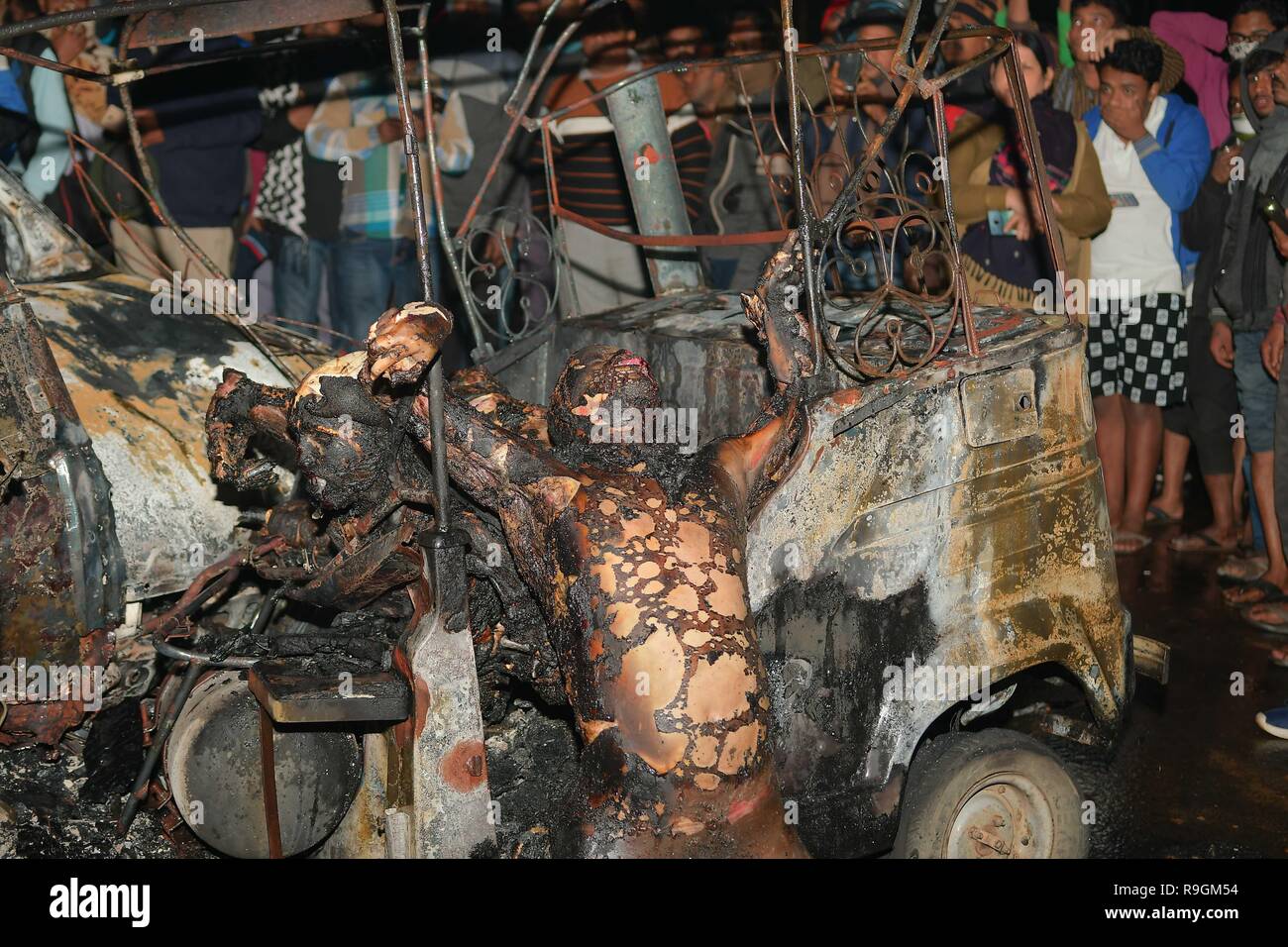 (EDITOR'S NOTE: IMAGE DEPICTS DEATH) After math of the crash seen with burnt bodies hanging out of the vehicle. Tragic road mishap at Amtali, 3 charred to death, 4 injured when two vehicles crushed face on resulting into a fire. Stock Photo