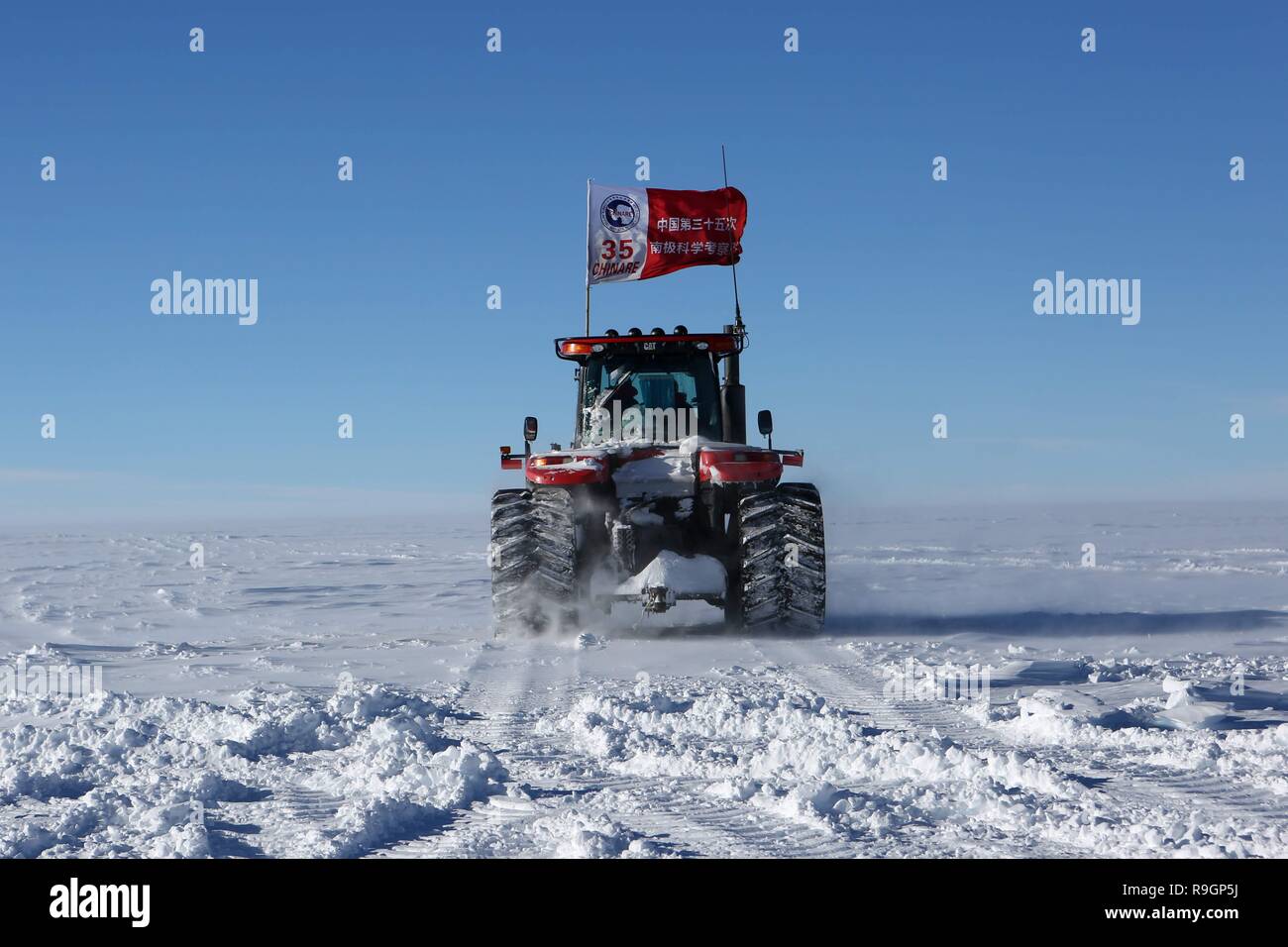 Beijing, China. 23rd Dec, 2018. A repaired snowmobile of China's research icebreaker Xuelong successfully gives a trial run in Antarctica, Dec. 23, 2018. Also known as the Snow Dragon, China's research icebreaker Xuelong carrying a research team set sail from Shanghai on Nov. 2, beginning the country's 35th Antarctic expedition which will last 162 days and cover 37,000 nautical miles (68,500 km). Credit: Liu Shiping/Xinhua/Alamy Live News Stock Photo