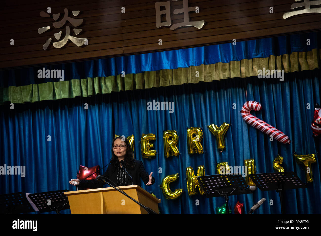 Hong Kong. 23rd Dec, 2018. Priest Ng See Wai seen addressing church goers during a service.Attendees and members of the congregation wear black during a church service ahead of Christmas, in solidarity with underground churches in China, especially larger establishments such as the Early Rain Covenant which has at least 500 members that are facing persecution. Credit: Stanley Leung/SOPA Images/ZUMA Wire/Alamy Live News Stock Photo