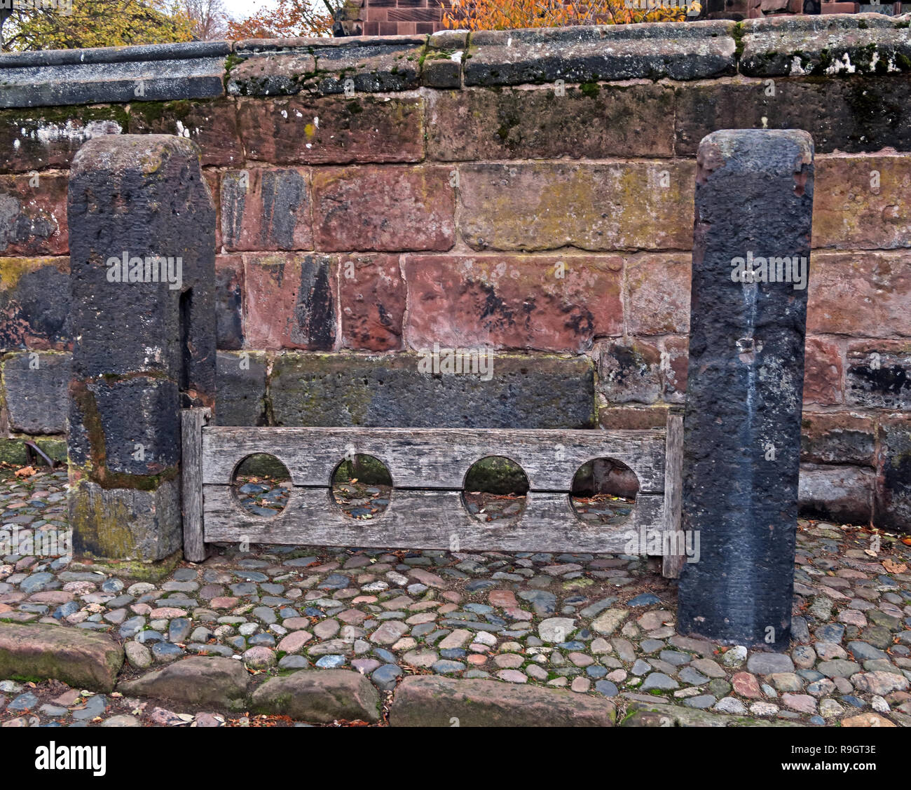 Gt Budworth wooden stocks, High St, near Northwich, Cheshire, North West England, UK Stock Photo