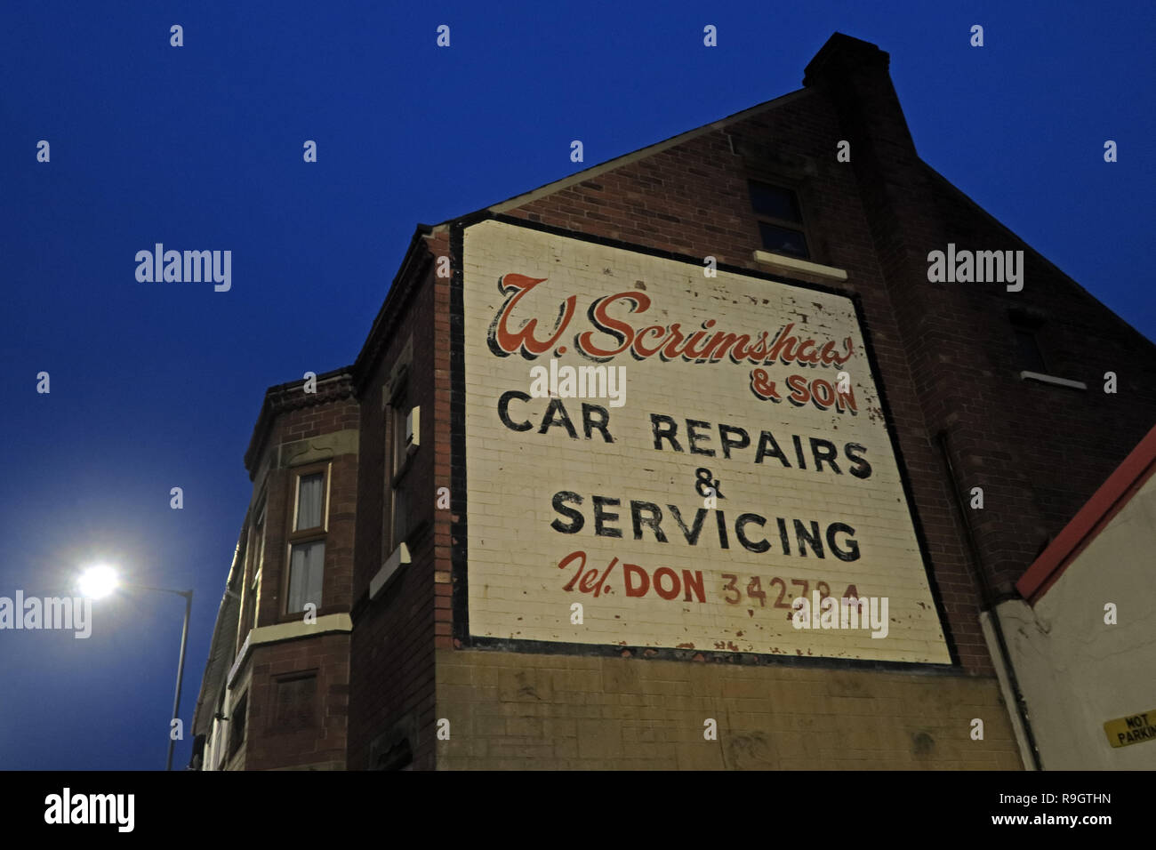 W.Scrimshaw and son, Car Repairs and Servicing, Don 342784, Balby Rd, Doncaster, South Yorkshire, England, UK,  DN4 0RE at dusk Stock Photo