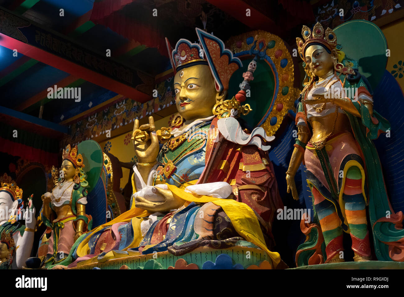 Nepal, Everest Base Camp Trek, Khumjung, Village Gompa interior, gilded Buddhist figure holding dorji Stock Photo