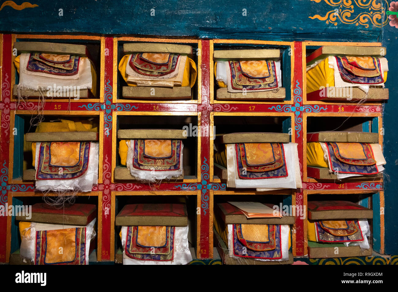 Nepal, Everest Base Camp Trek, Khumjung, Samten Choling Gompa interior, ancient Buddhist religious texts in niches Stock Photo