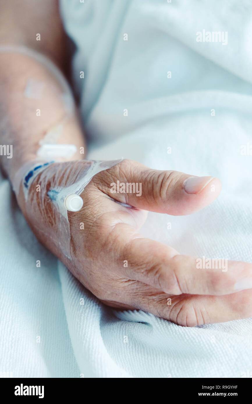 saline injection Medical Care, Close up of Saline injection into hand Stock Photo - Alamy