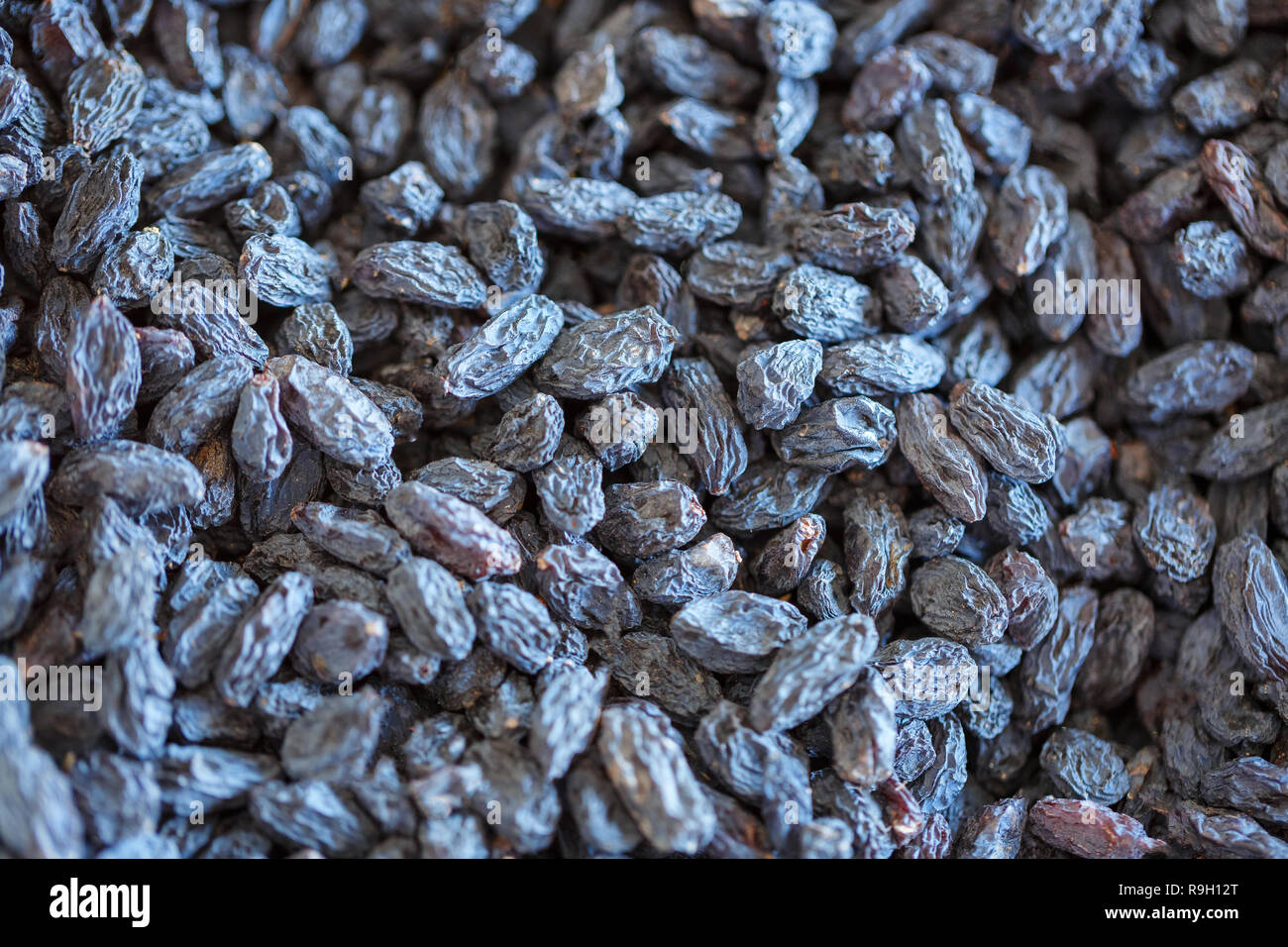 blue dried raisins closeup top view Stock Photo - Alamy