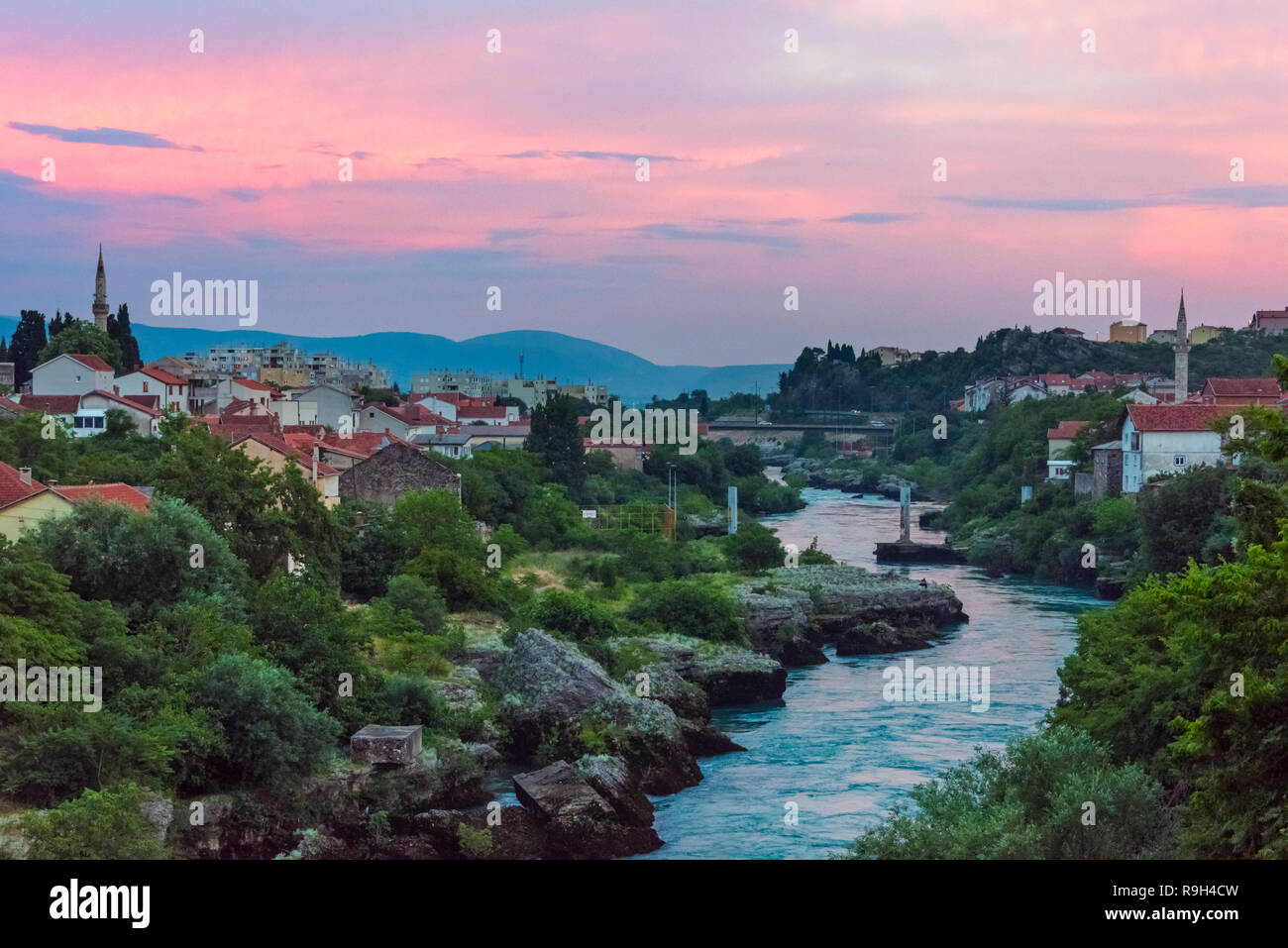 Mosque and houses along the Neretva River, Mostar, Bosnia and Herzegovina Stock Photo