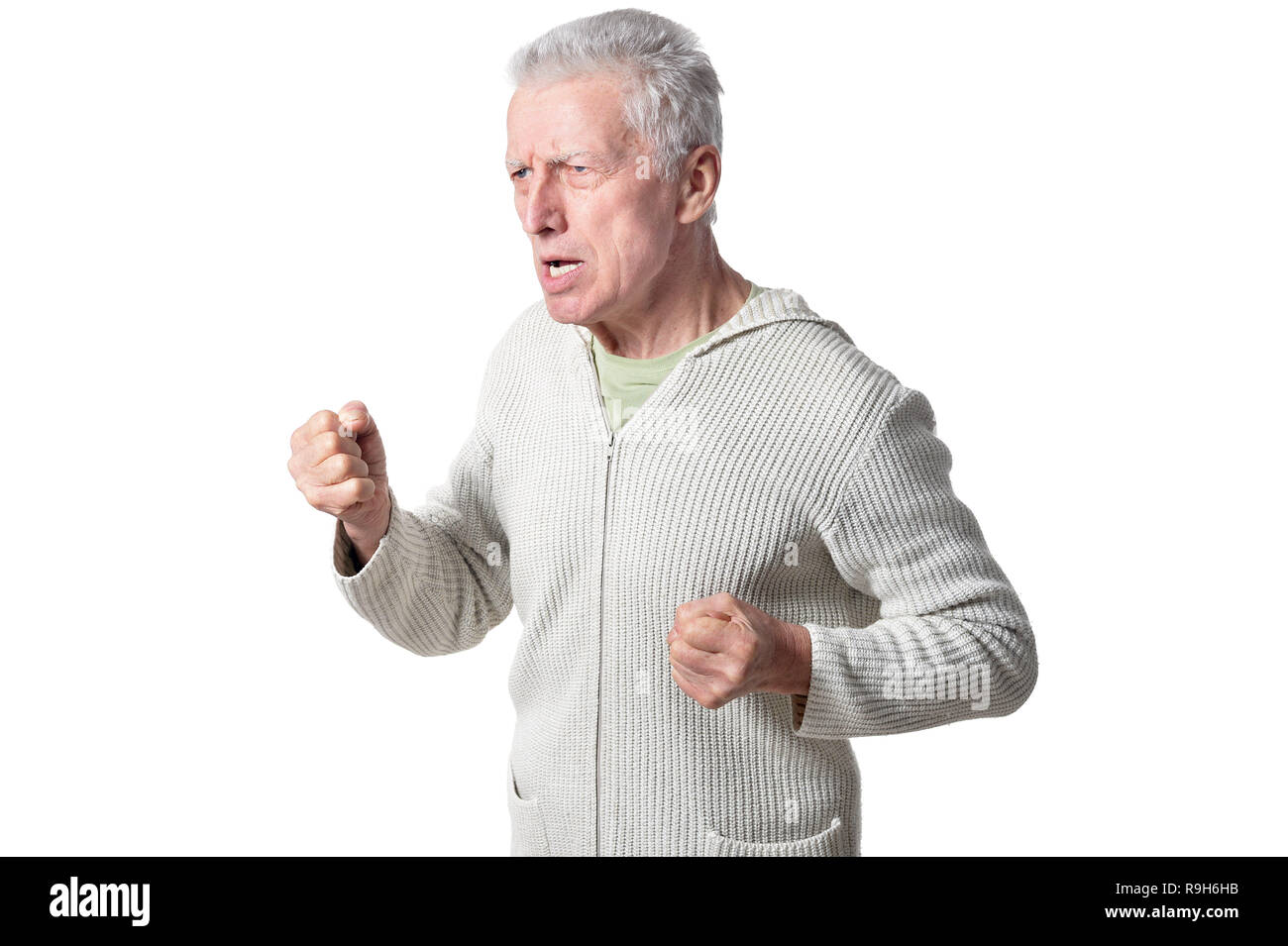 Portrait of senior man posing isolated on white background Stock Photo ...