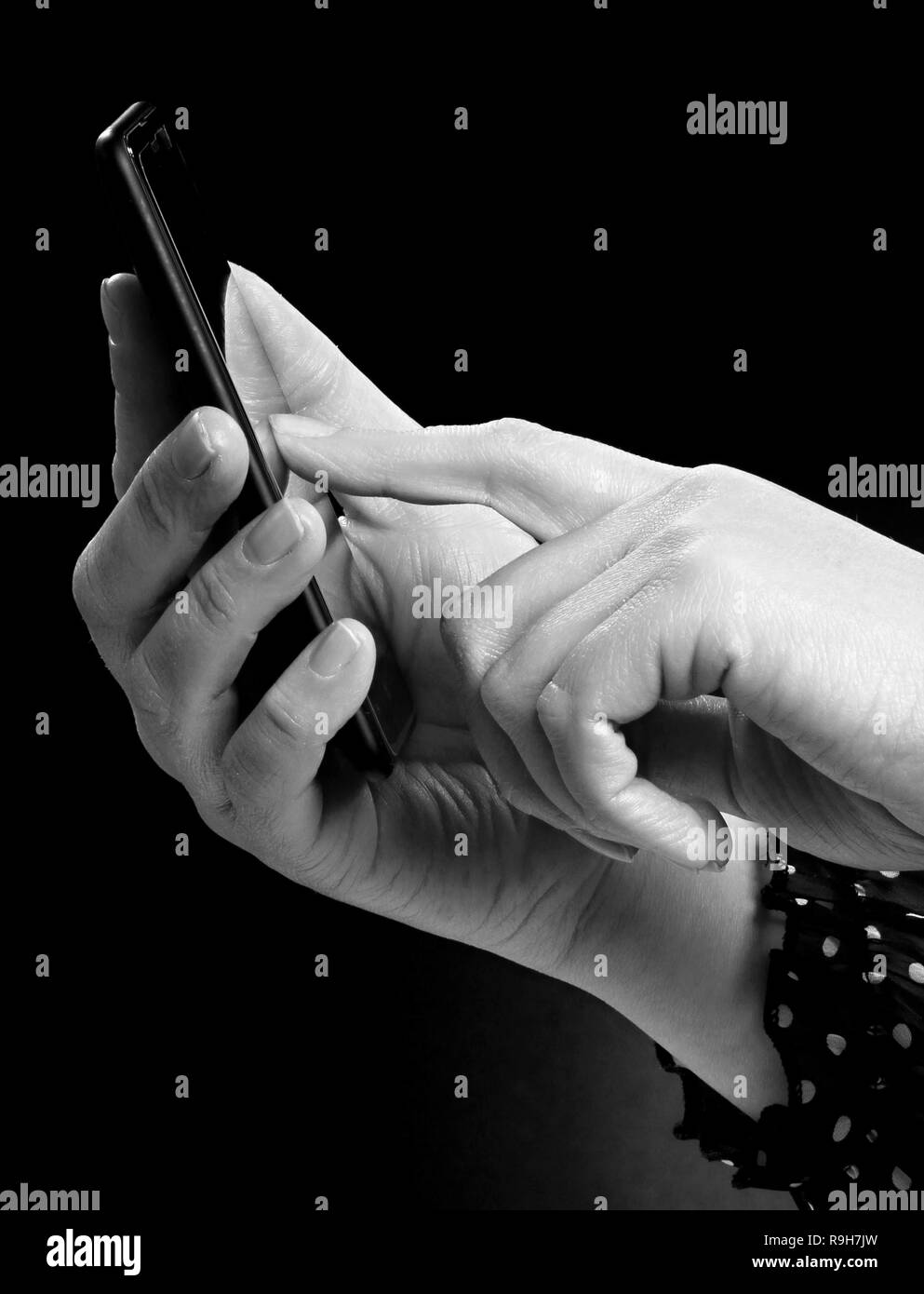 woman with mobile phone in hand stock photo Stock Photo