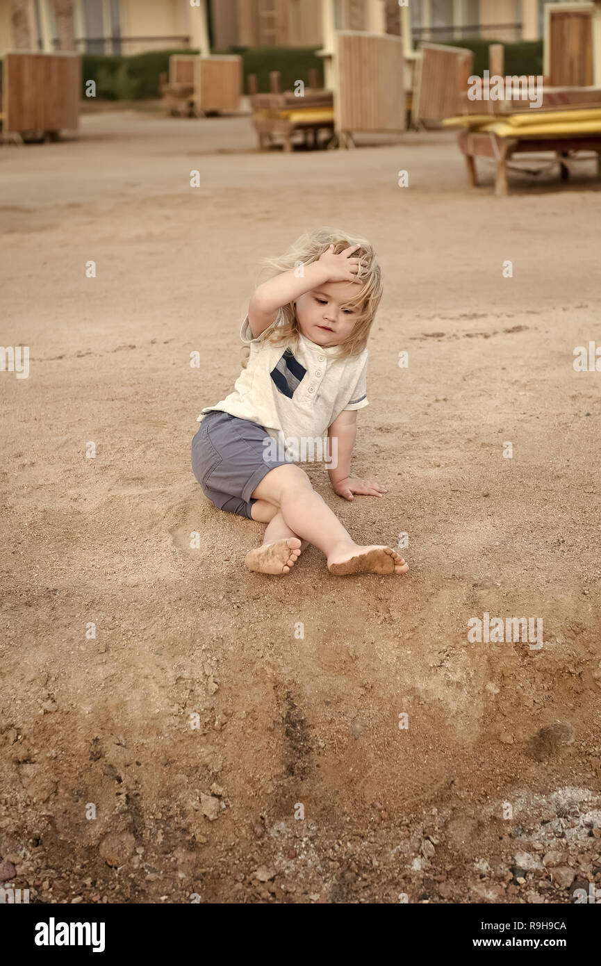 Boy With Blond Hair Have Fun On Sand Summer Vacation Recreation