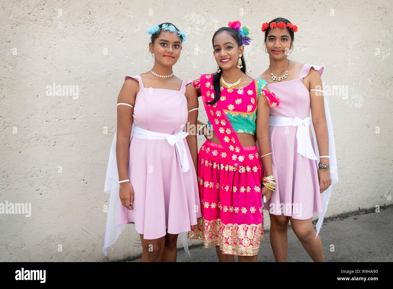 Posed portrait of three pretty Hindu teenagers at the Queens Cancer