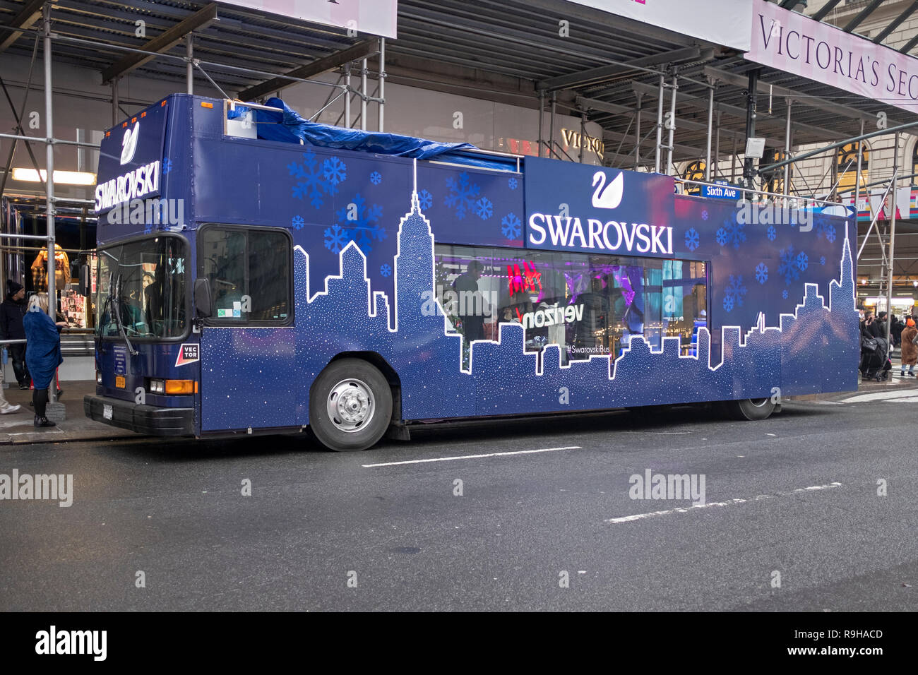 A side view of the SWAROVSKI HOLIDAY BUS embellished with Swarovski crystals. On Sixth Ave and West 35th Street in Manhattan, NYC. Stock Photo