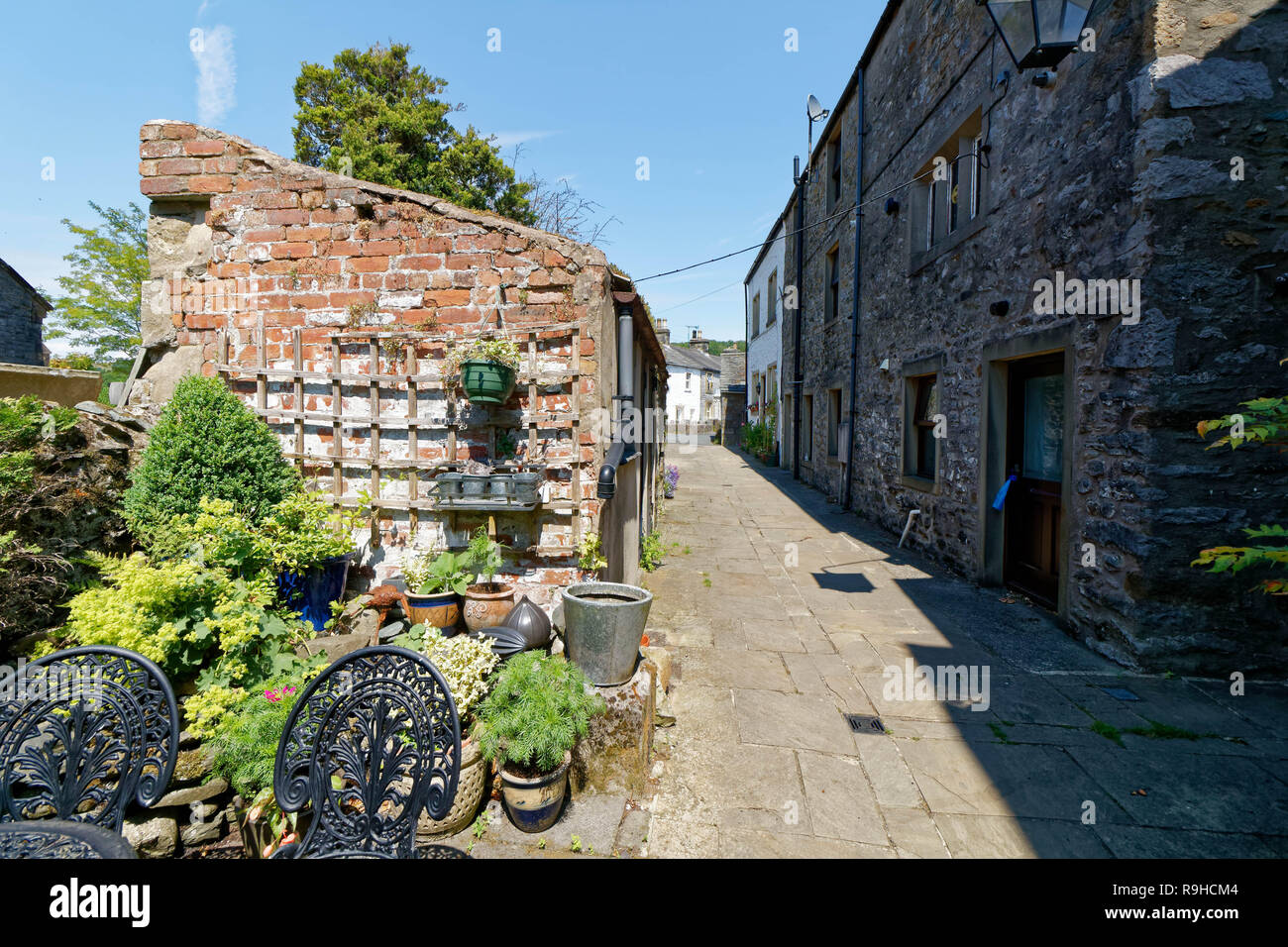 A quaint stone and brick back lane in ingleton, yorkshire Stock Photo