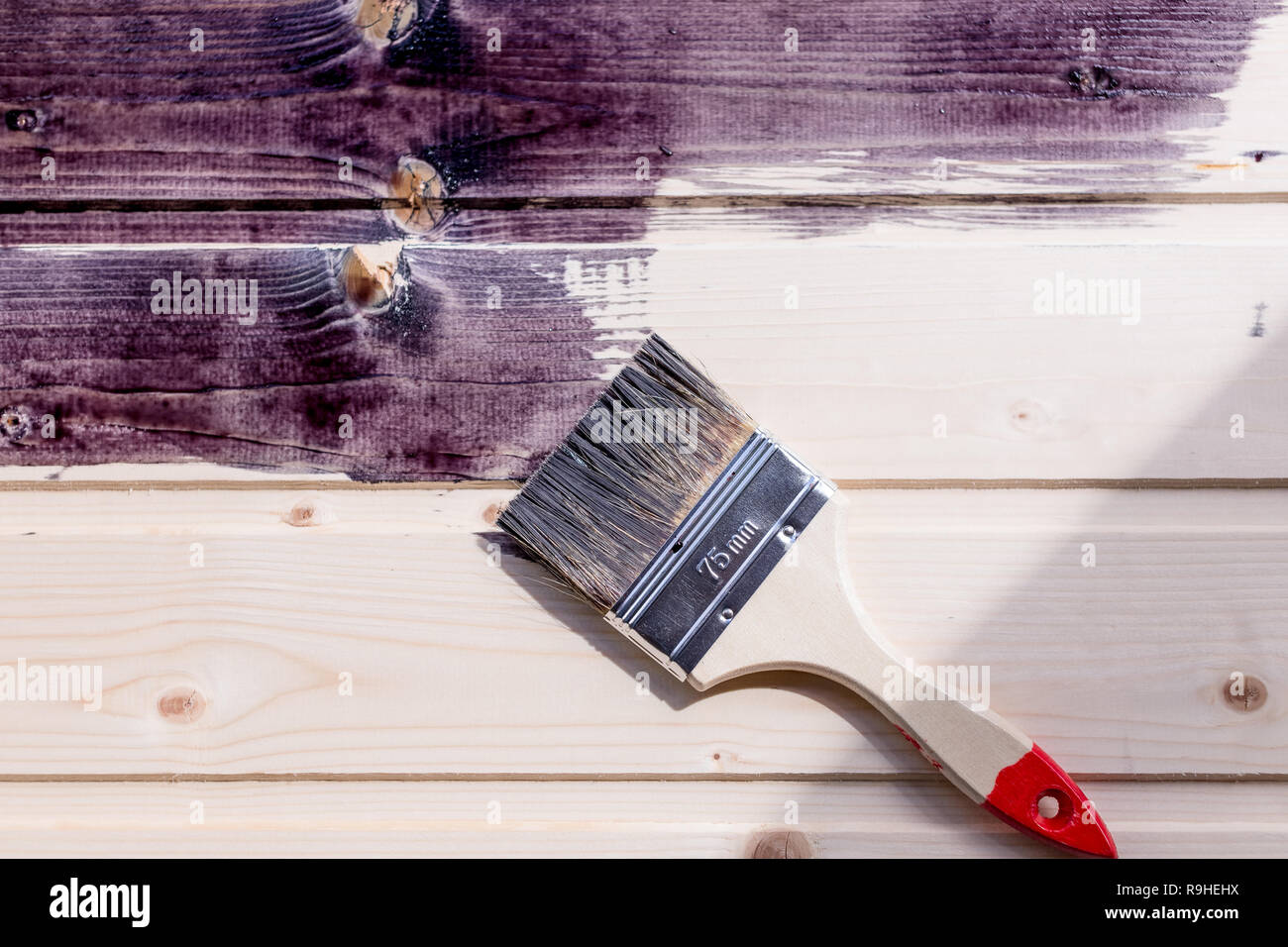 Half Painted Wooden Surface Black Color Varnishing Natural Wood With Paint Brush Painting Natural Wood Wall