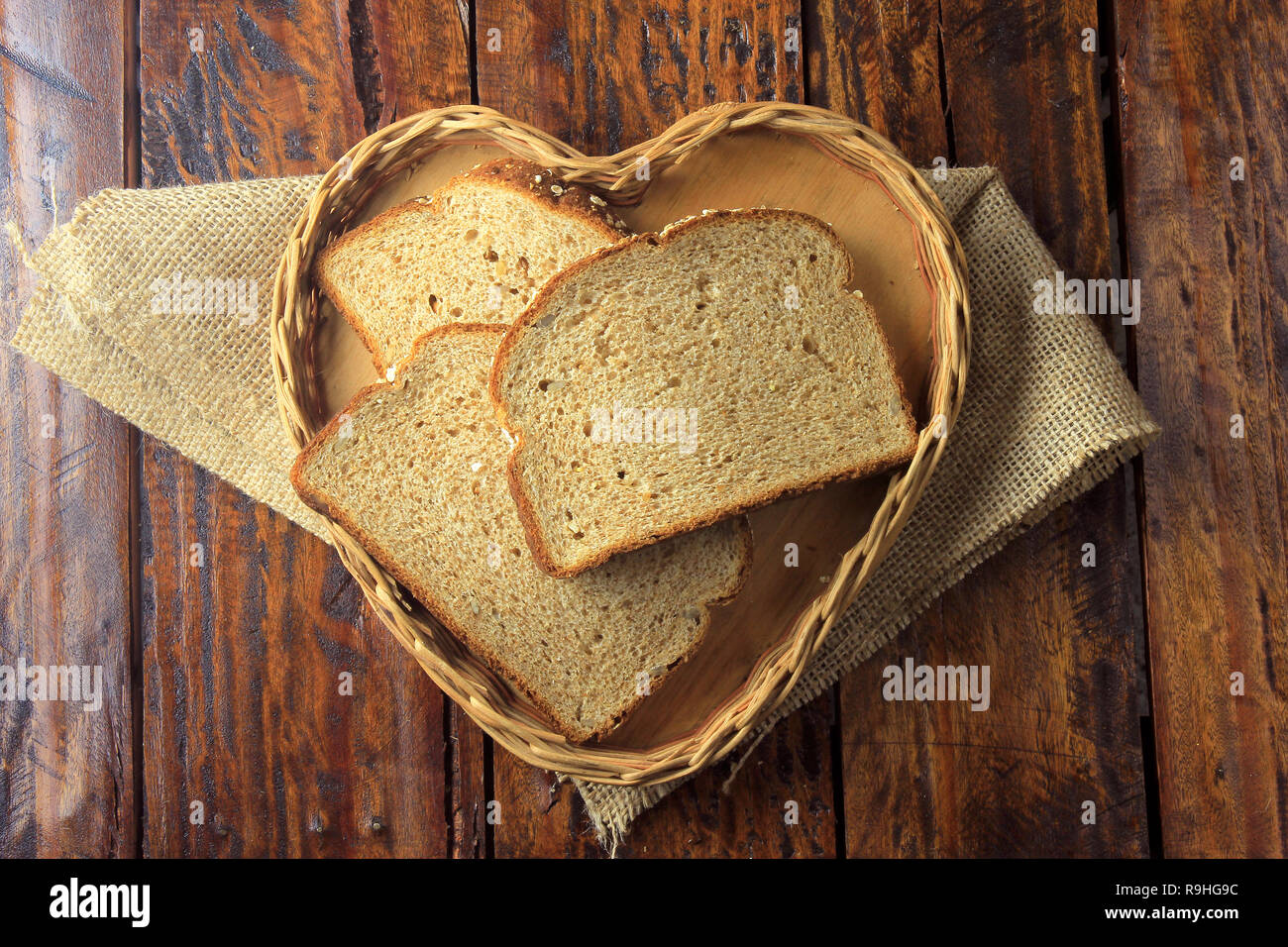 Organic sliced wholemeal bread, made from oats and flax seeds inside ...