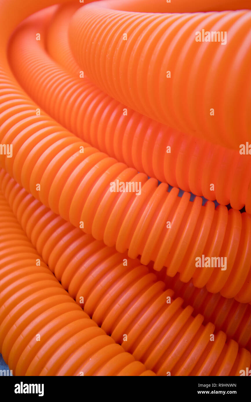 a bunch of orange plastic tubes Stock Photo Alamy