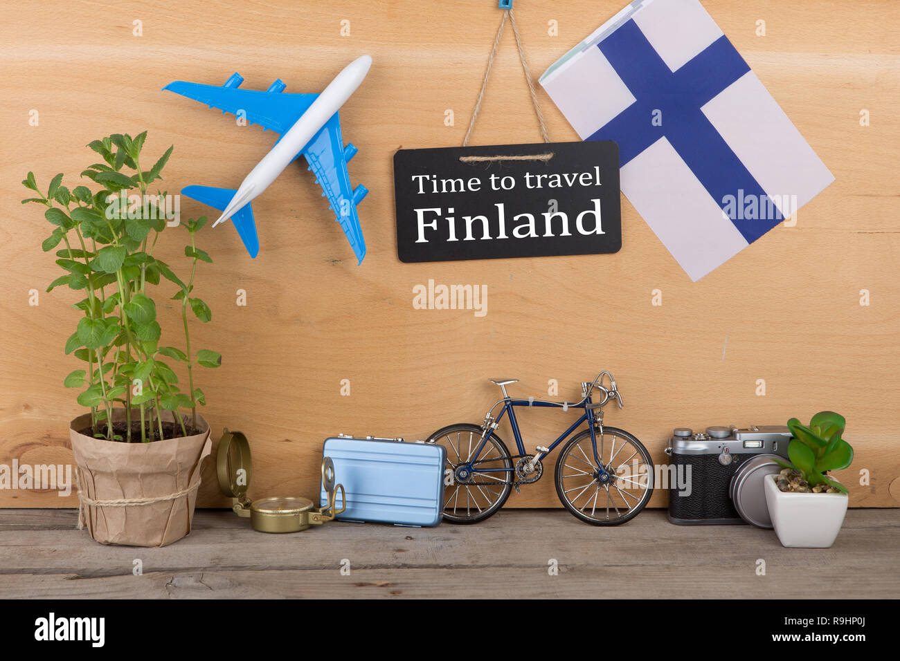 Travel time concept blackboard with text "Time to travel Finland", flag of the Finland
