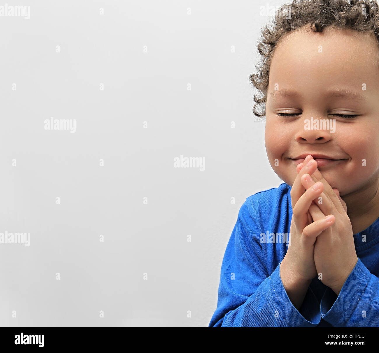 little boy praying to God with hands together stock photo Stock Photo -  Alamy