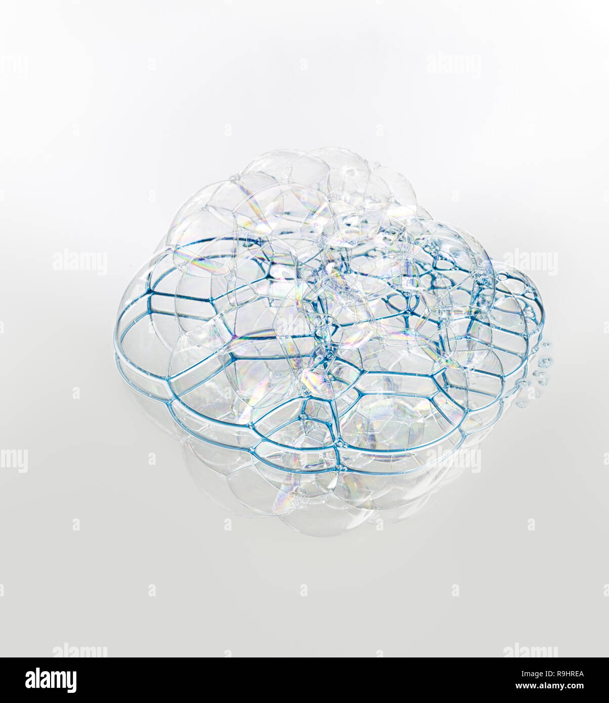 Soap bubbles with reflection on white background Stock Photo - Alamy