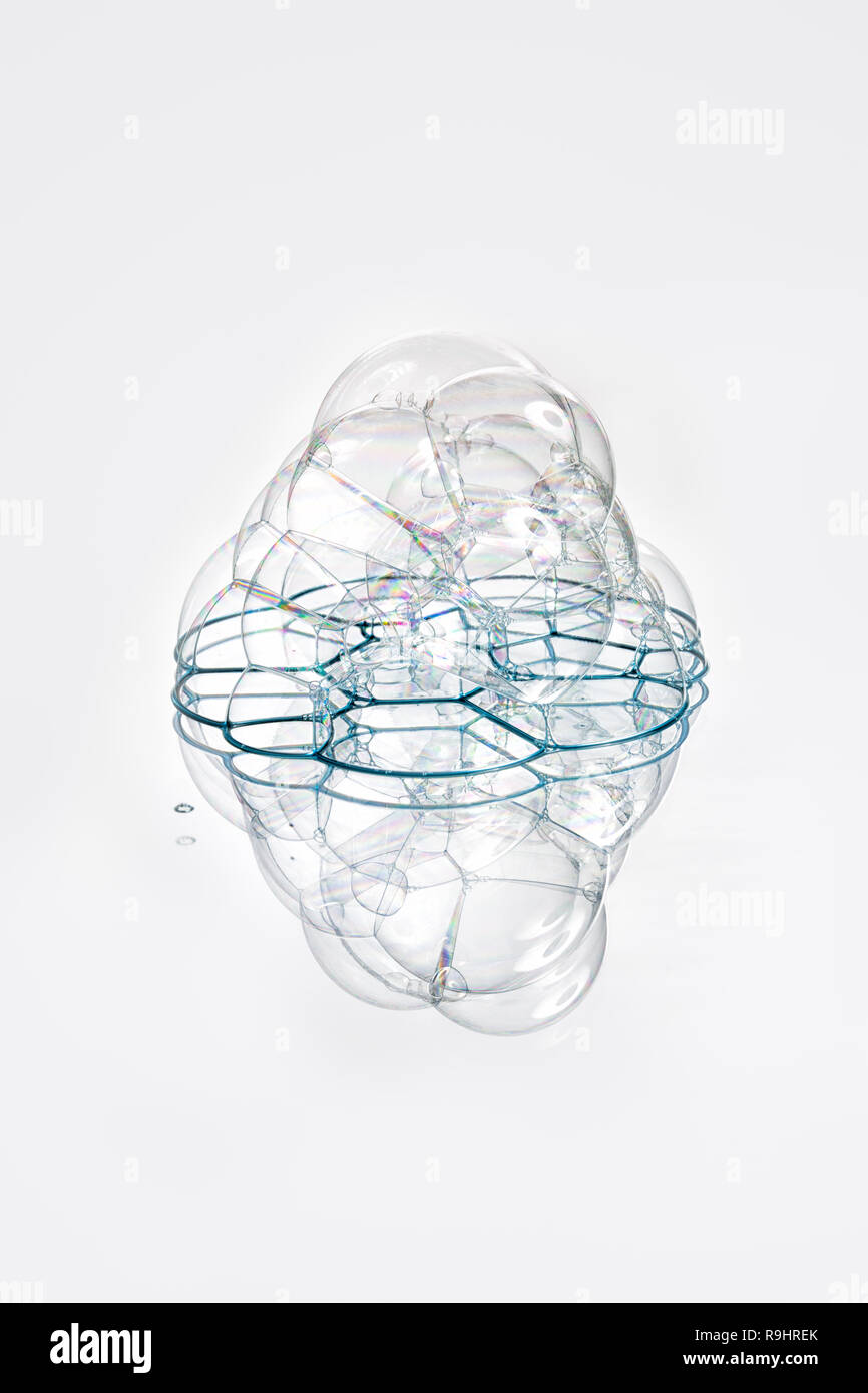 Soap bubbles with reflection on white background Stock Photo - Alamy