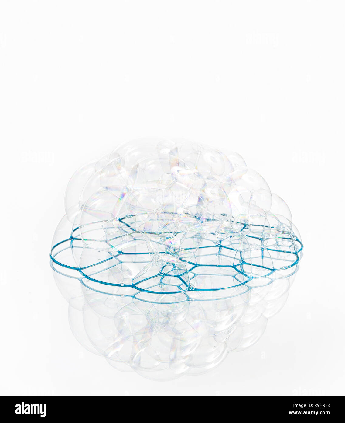 Soap bubbles with reflection on white background Stock Photo - Alamy
