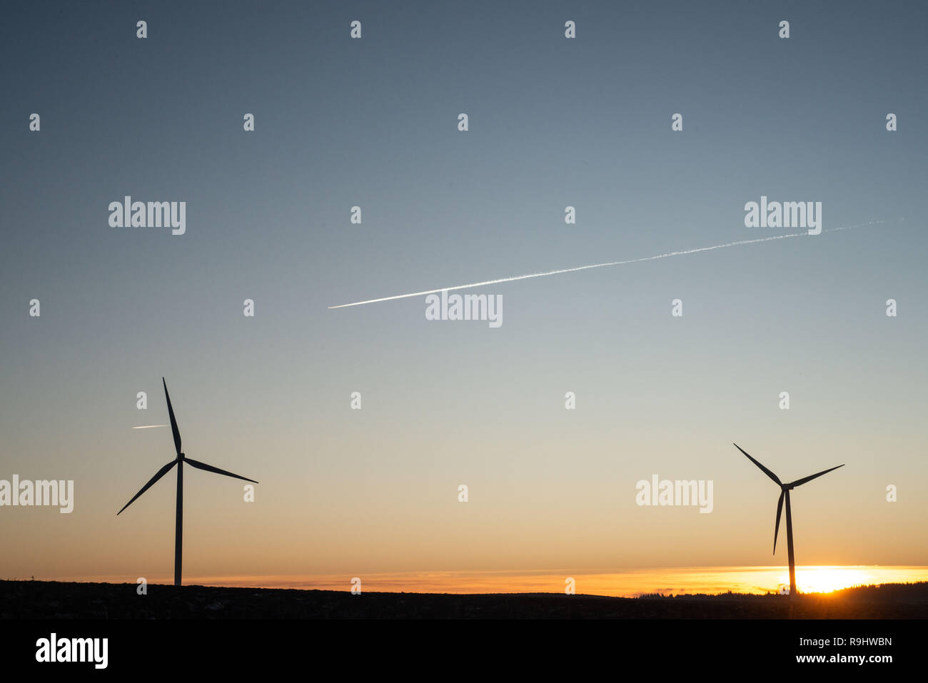 Wind turbines at Pates Wind Farm near West Calder at sunset Stock Photo