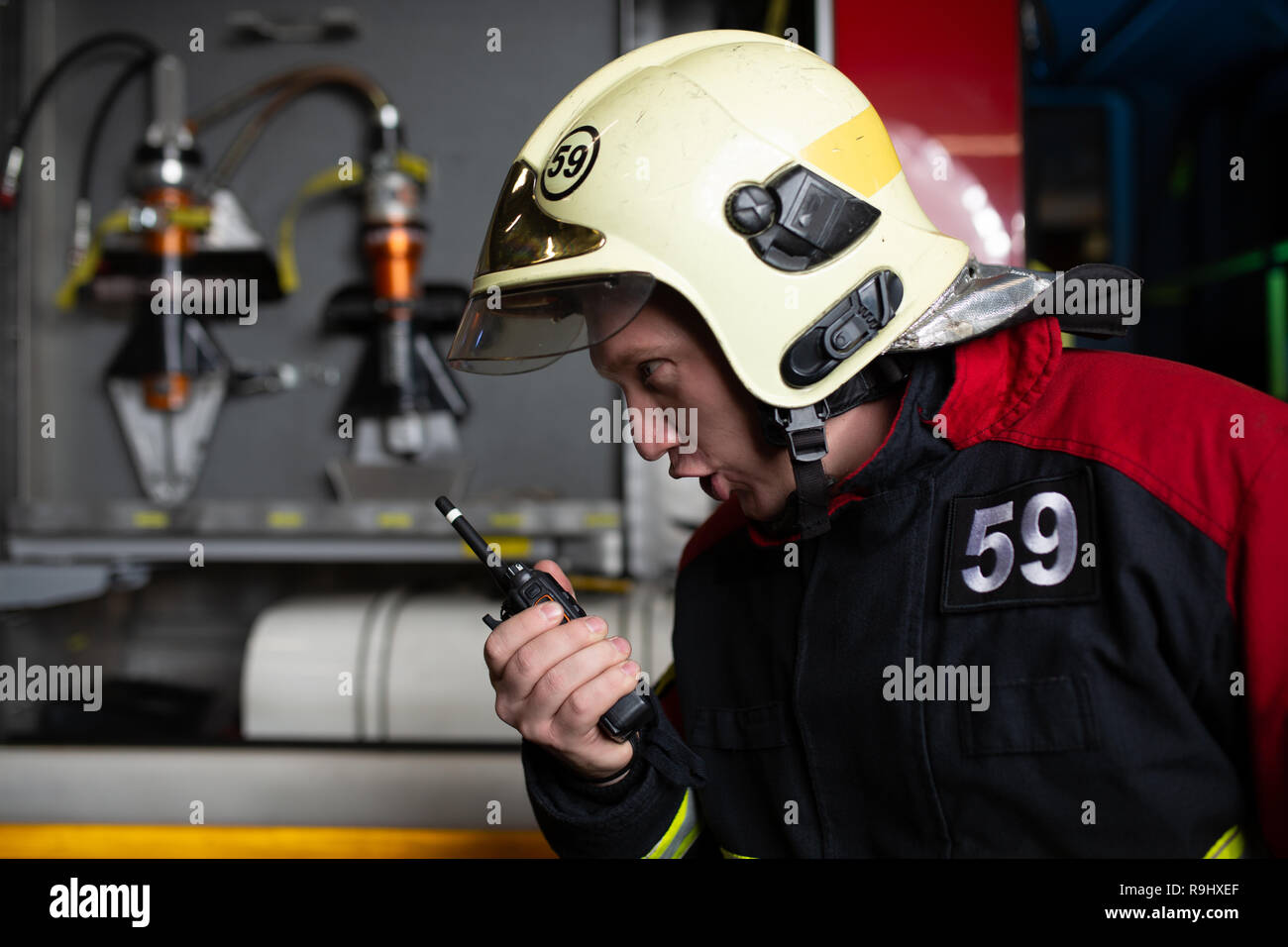 Image of man firefighter in helmet talking on radio Stock Photo Alamy