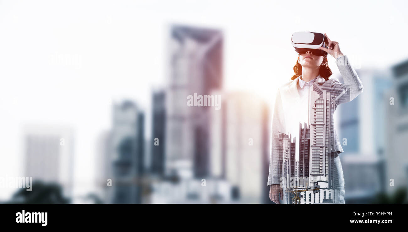 Woman in mask against sunrise above city trying virtual reality Stock ...