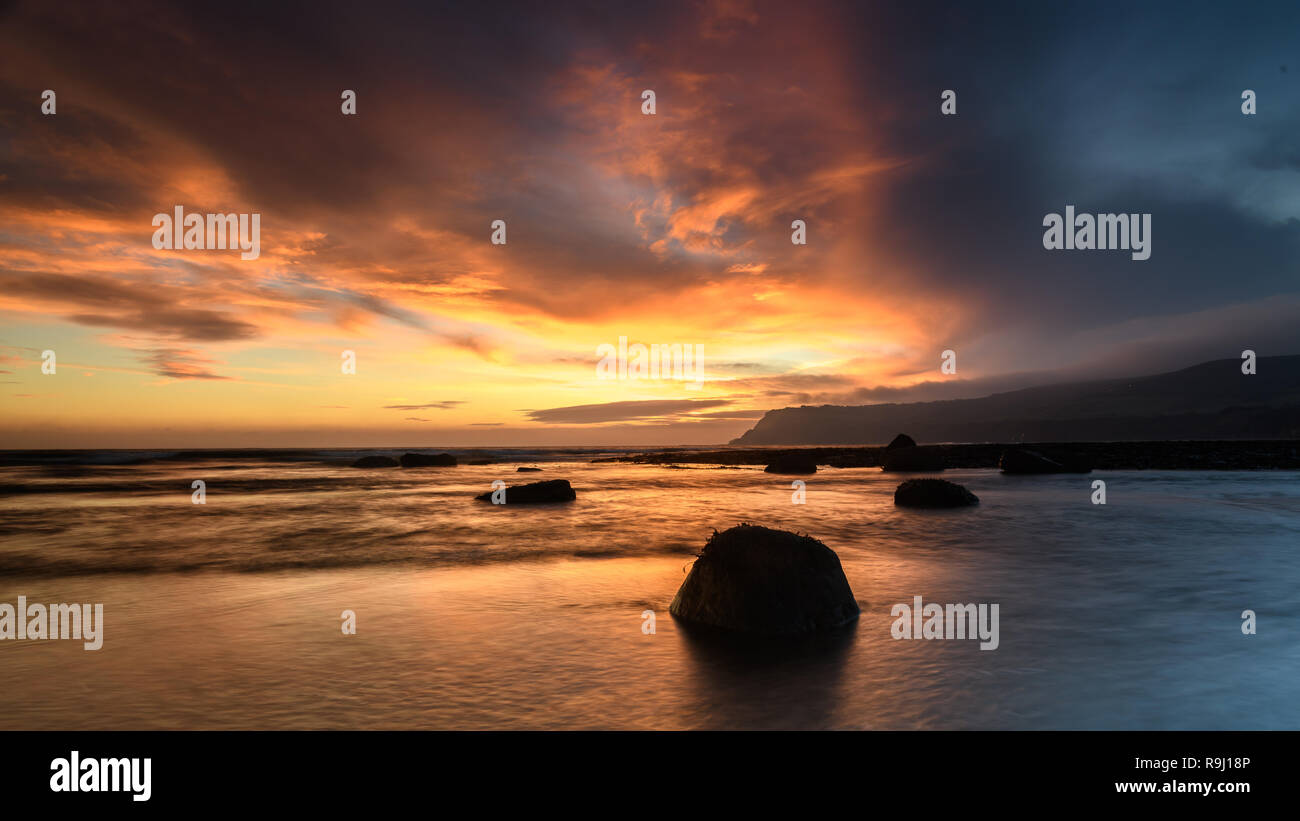 Coastal Sunrise at Robin Hoods Bay Stock Photo