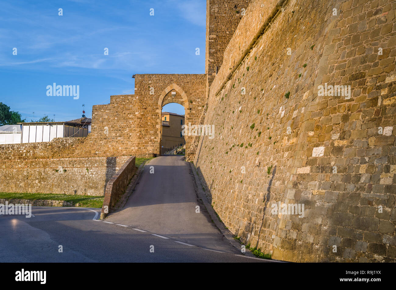 Montalcino fortress walls and tower fortress entrance gate. Toscana, Italy. Stock Photo